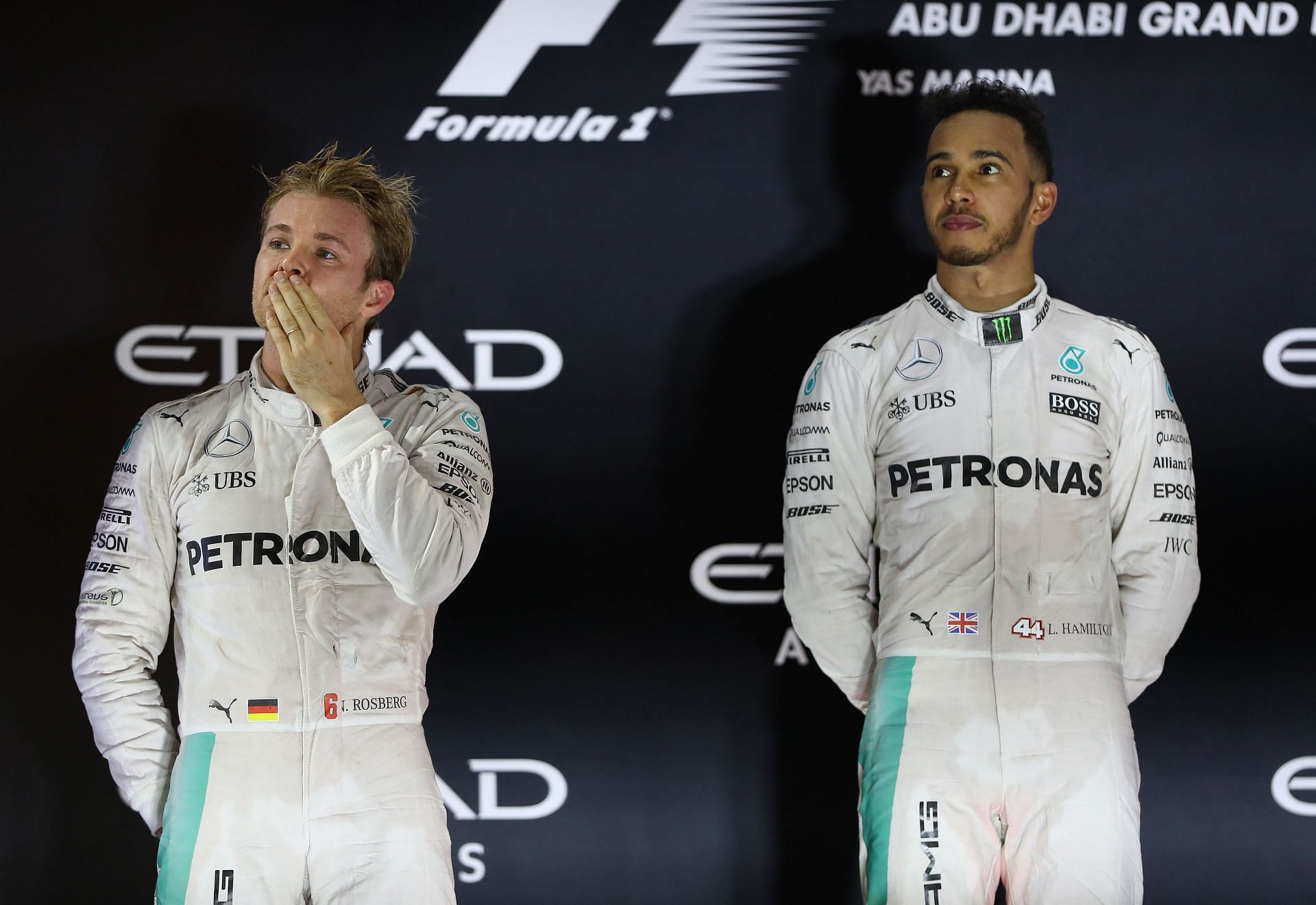 Nico Rosberg (left) and Lewis Hamilton (right) on the podium after the 2016 F1 Abu Dhabi GP. (Photo by Clive Mason/Getty Images)