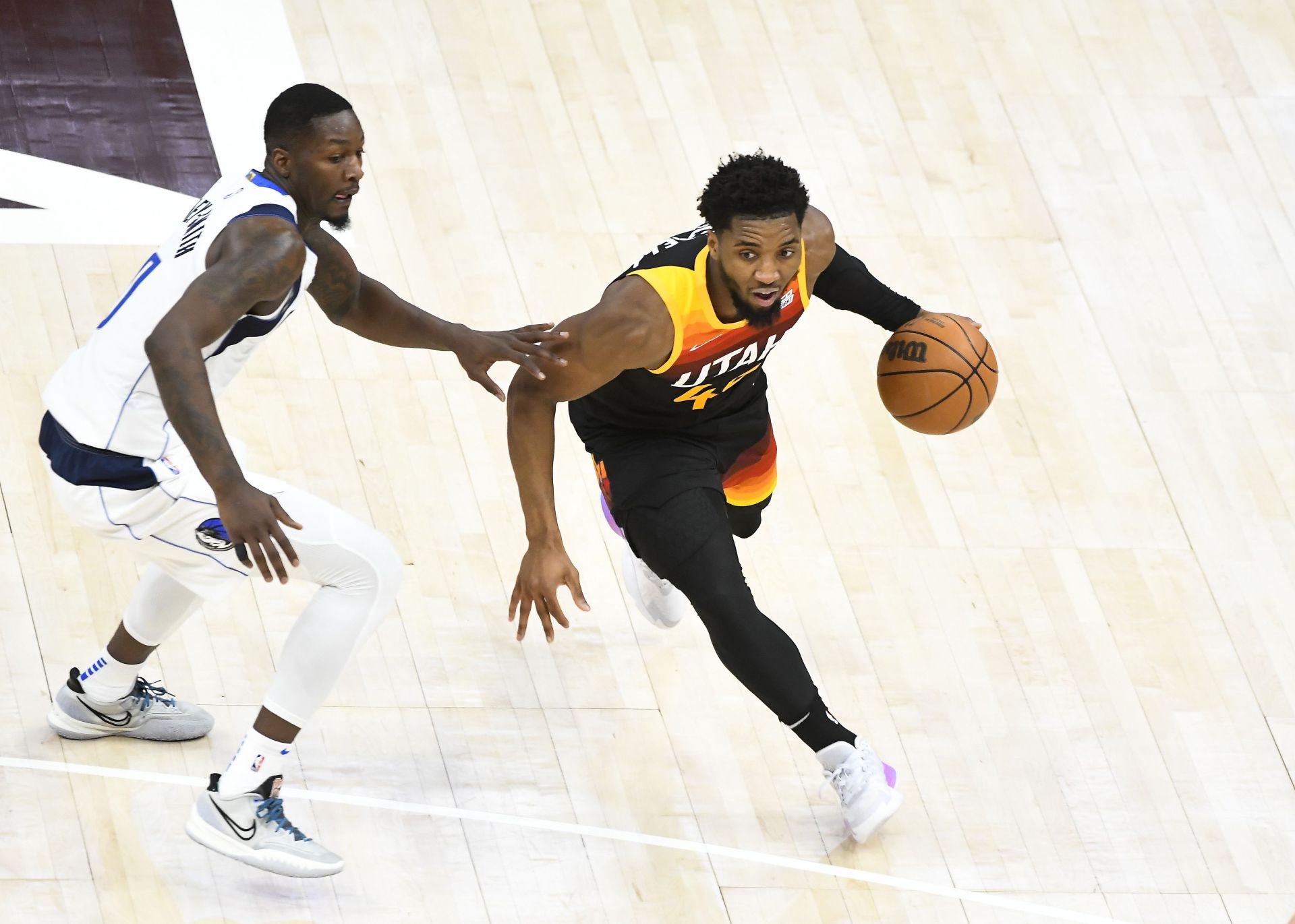 Donovan Mitchell #45 of the Utah Jazz drives around Dorian Finney-Smith #10 of the Dallas Mavericks during the first half of Game 6 of the Western Conference First Round Playoffs at Vivint Smart Home Arena on April 28, 2022 in Salt Lake City, Utah.