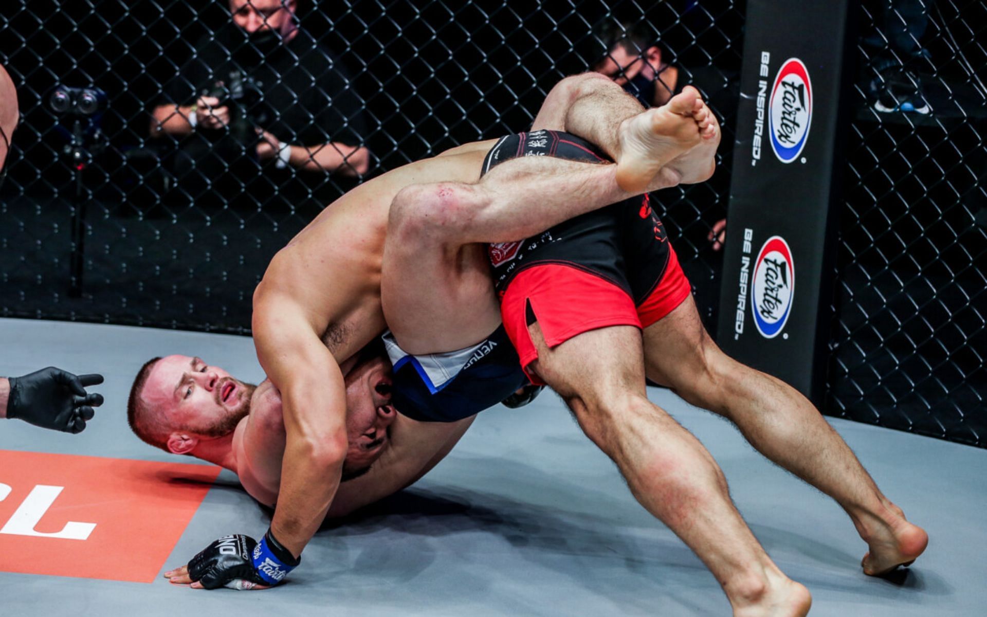 Vitaly Bigdash chokes out Fan Rong. [Photo ONE Championship]