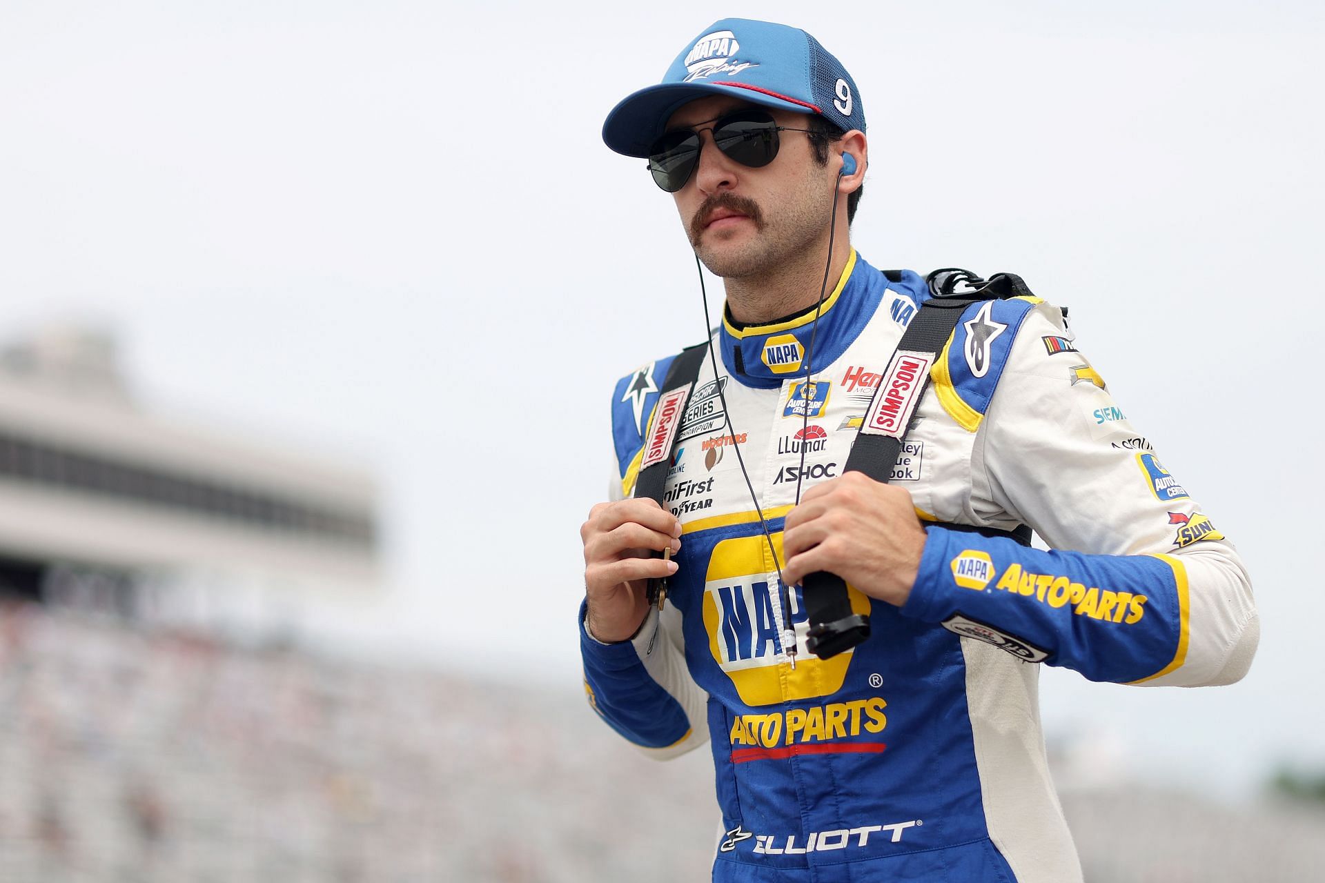 Chase Elliott walks the grid during qualifying for the NASCAR Cup Series Ambetter 301 at New Hampshire Motor Speedway