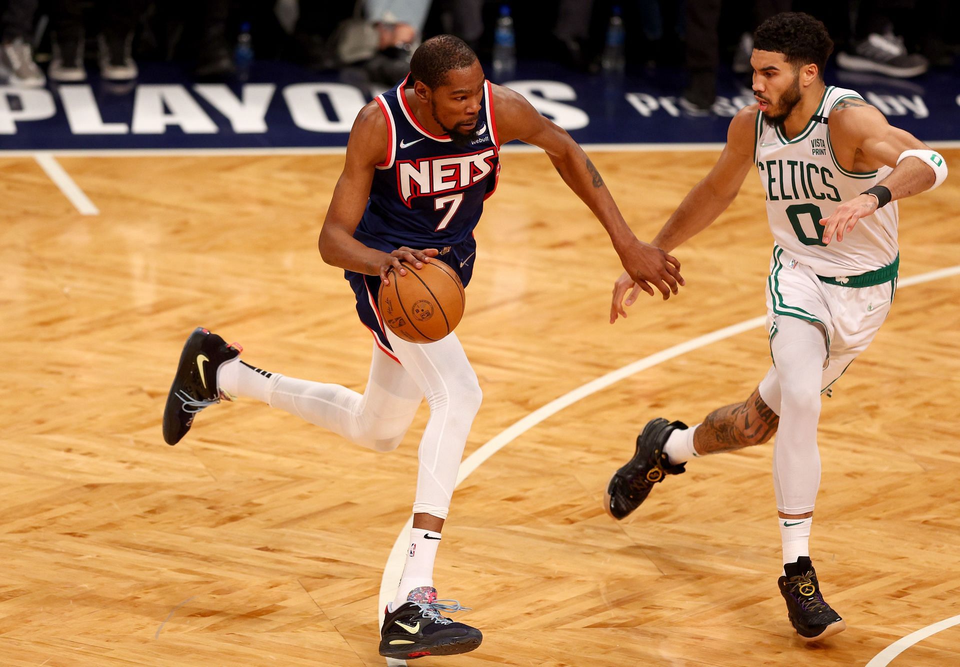 Kevin Durant of the Brooklyn Nets drives as Jayson Tatum of the Boston Celtics defends