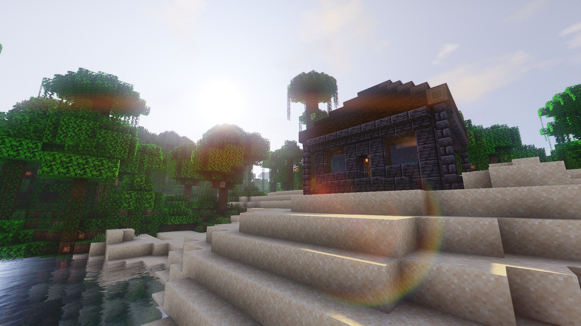 A beachside base as seen with TME Shaders (Image via Mojang)