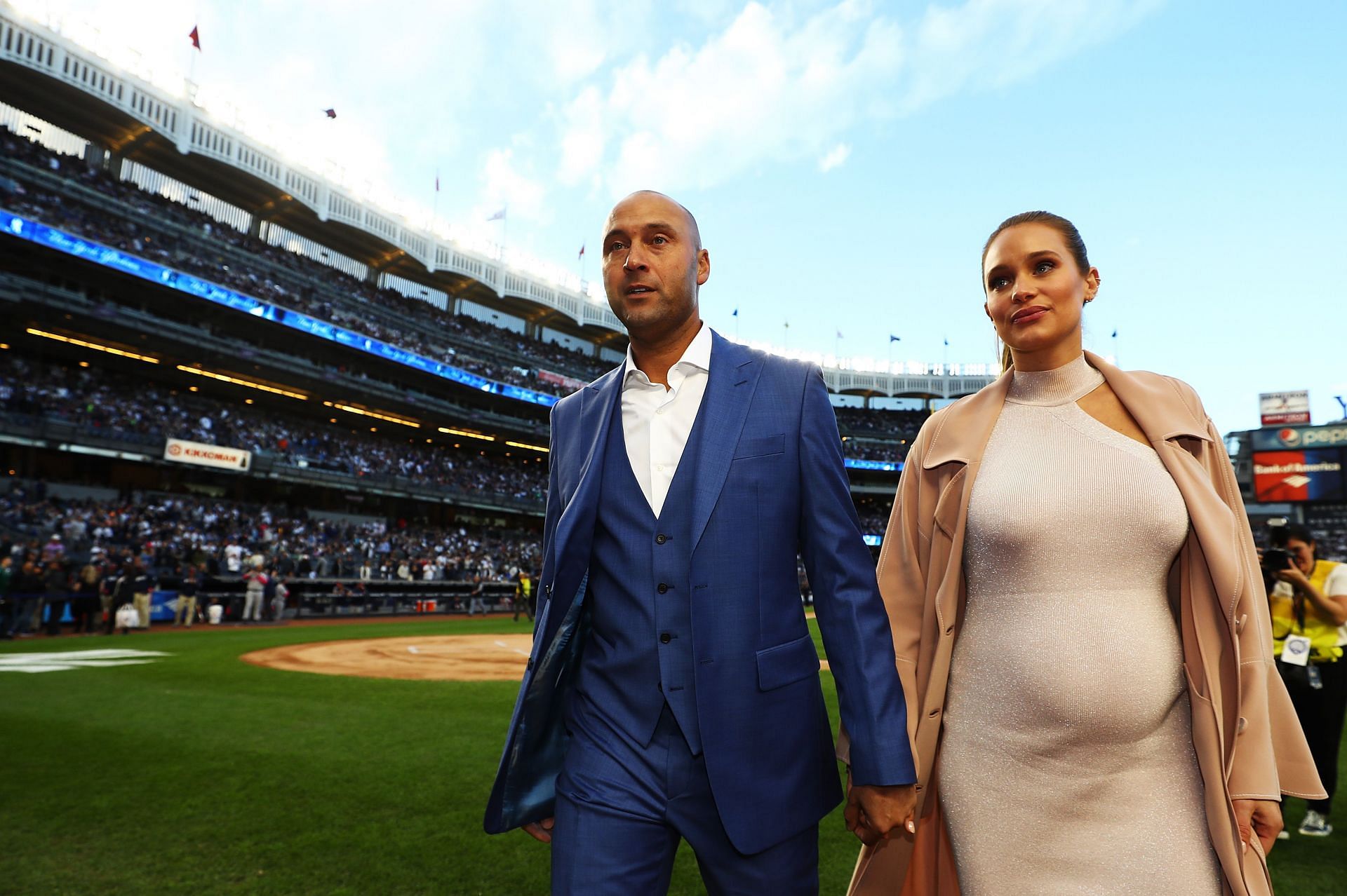 Derek Jeter and his Wife Hannah Davis walk off the field after the retirement of Derek Jeter&#039;s jersey