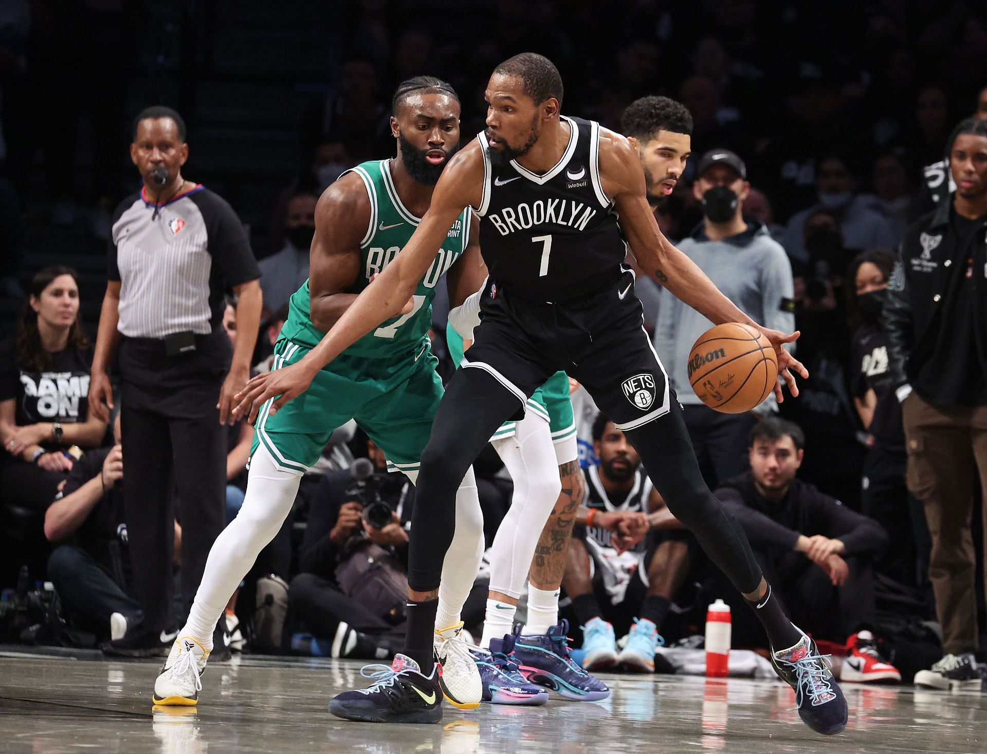 Kevin Durant #7 of the Brooklyn Nets dribbles against Jaylen Brown #7 of the Boston Celtics during Game Three of the Eastern Conference First Round NBA Playoffs at Barclays Center on April 23, 2022 in New York City.