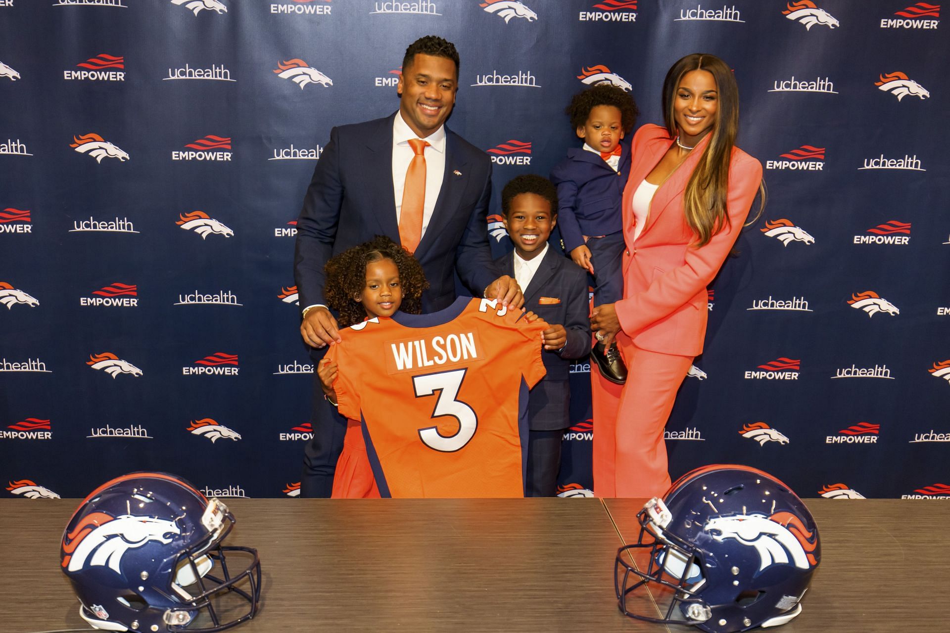 Russell Wilson with his wife Ciara and their children
