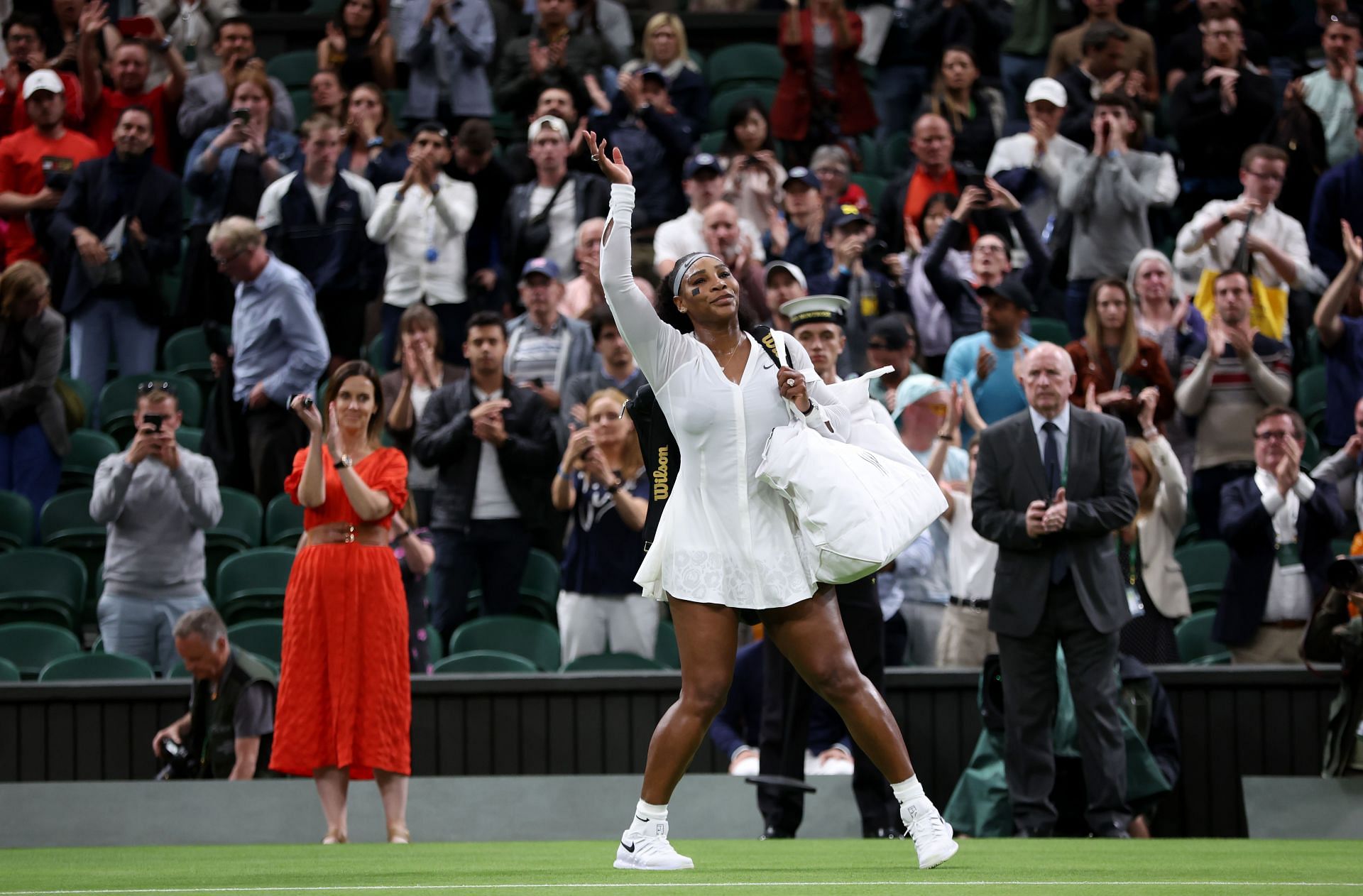 Serena Williams waves goodbye to the crowd after her defeat at Wimbledon 2022