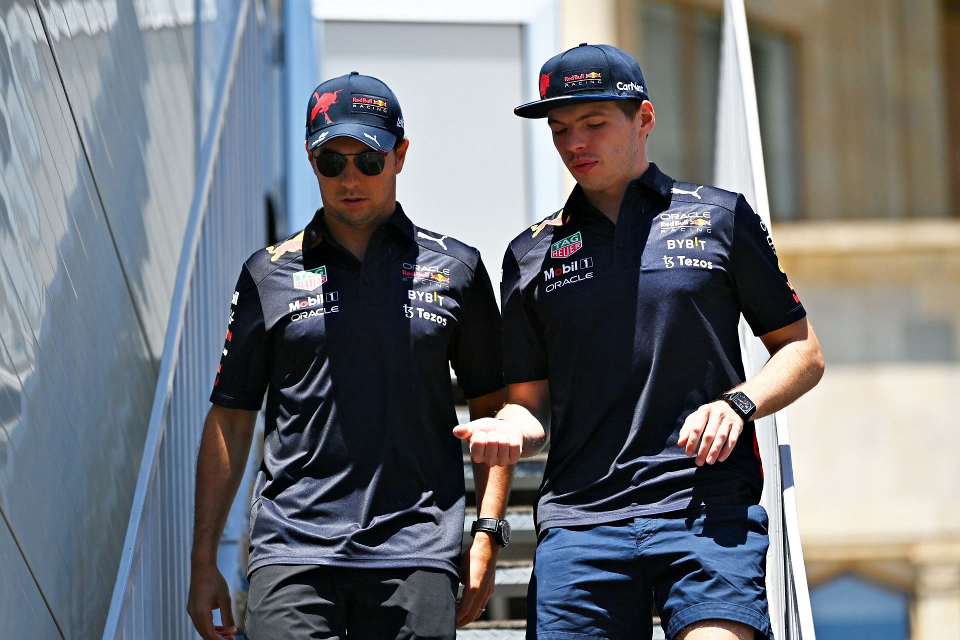 Sergio Perez (left) and Max Verstappen (right) walk in the Paddock ahead of the 2022 F1 Grand Prix of Azerbaijan (Photo by Dan Mullan/Getty Images)