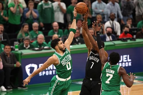 Kevin Durant shoots over Jayson Tatum and Jaylen Brown