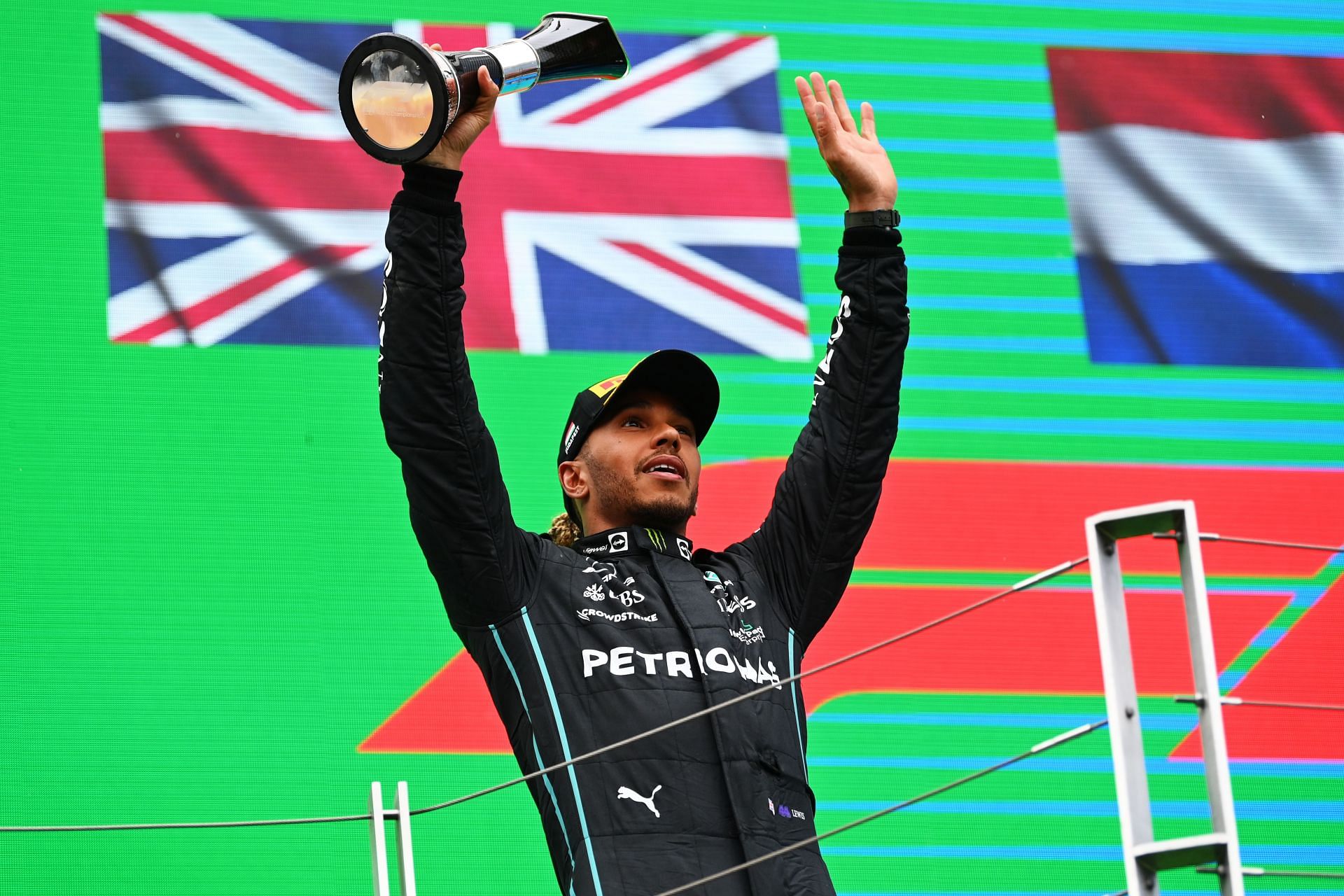 Mercedes driver Lewis Hamilton celebrates on the podium after his P2 finish at the 2022 F1 Hungarian GP. (Photo by Dan Mullan/Getty Images)