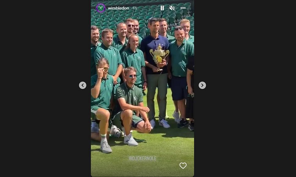 Novak Djokovic celebrates with the Wimbledon staff after winning the Wimbledon 2022 title