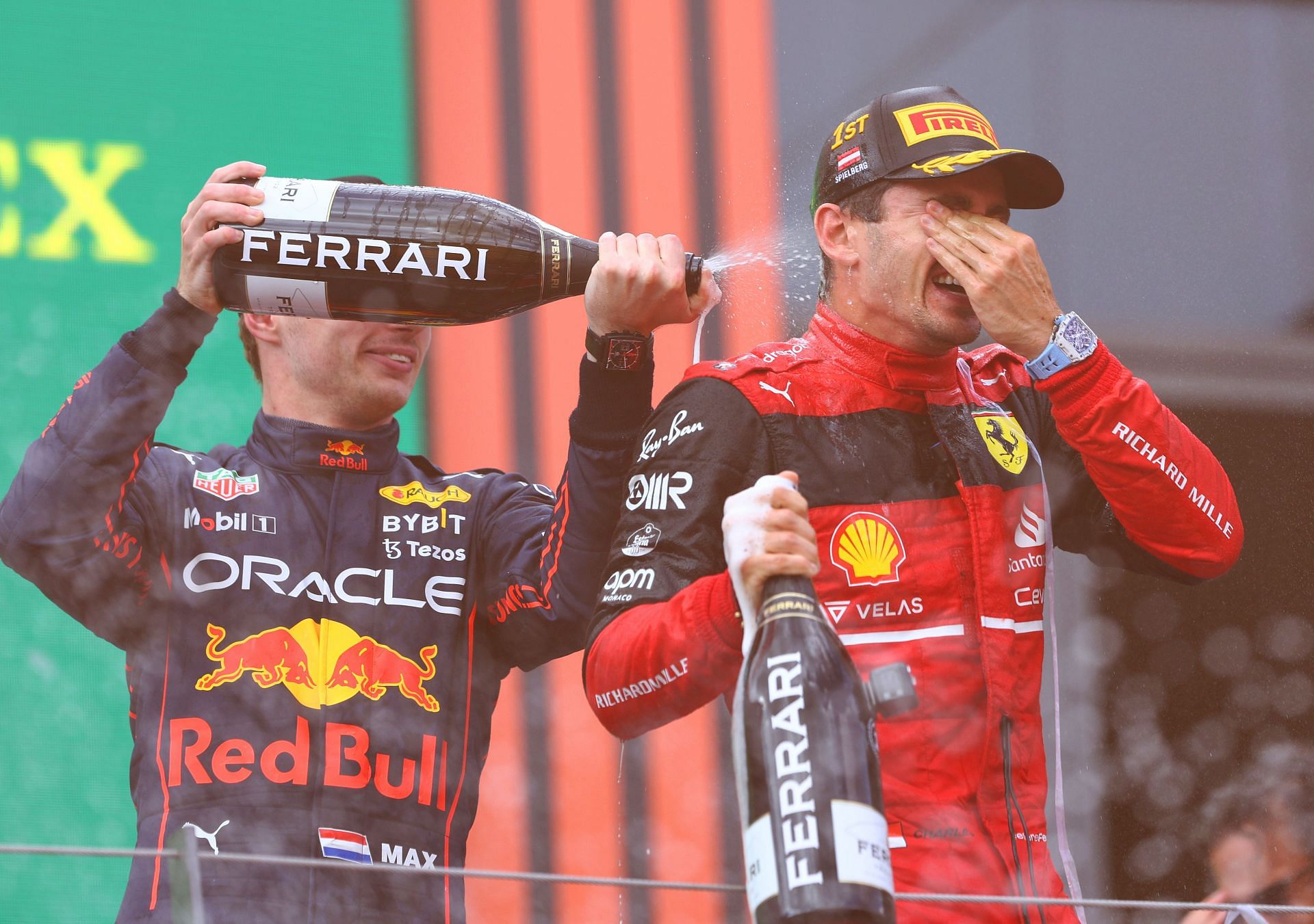 Charles Leclerc (right) and Max Verstappen (left) celebrate on the podium during the F1 Grand Prix of Austria at Red Bull Ring on July 10, 2022, in Spielberg, Austria (Photo by Clive Rose/Getty Images)