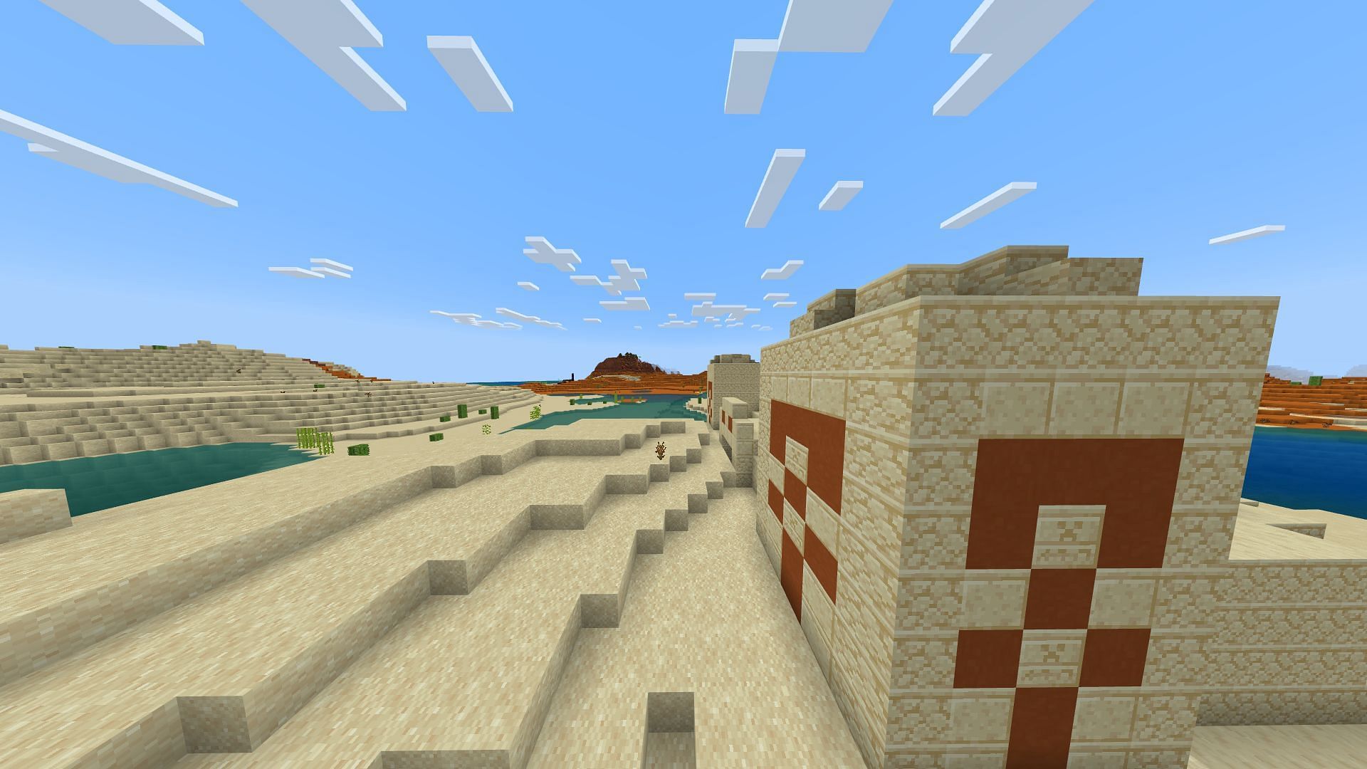 A desert temple and a ruined portal in the distance (Image via Minecraft)