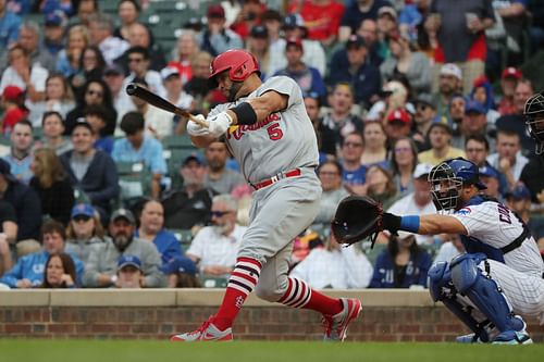 Albert Pujols swings at a pitch during a St. Louis Cardinals v Chicago Cubs game at Wrigley Field 