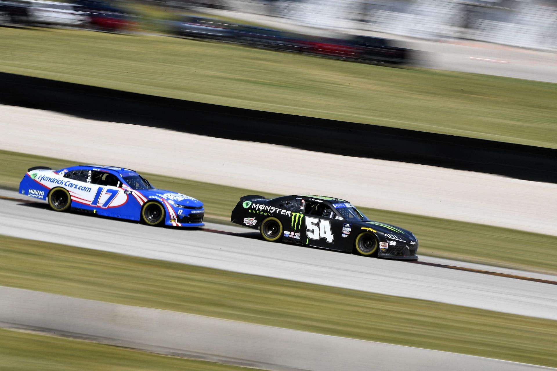 Ty Gibbs and Kyle Larson race during the NASCAR Xfinity Series Henry 180 at Road America (Photo by Logan Riely/Getty Images)