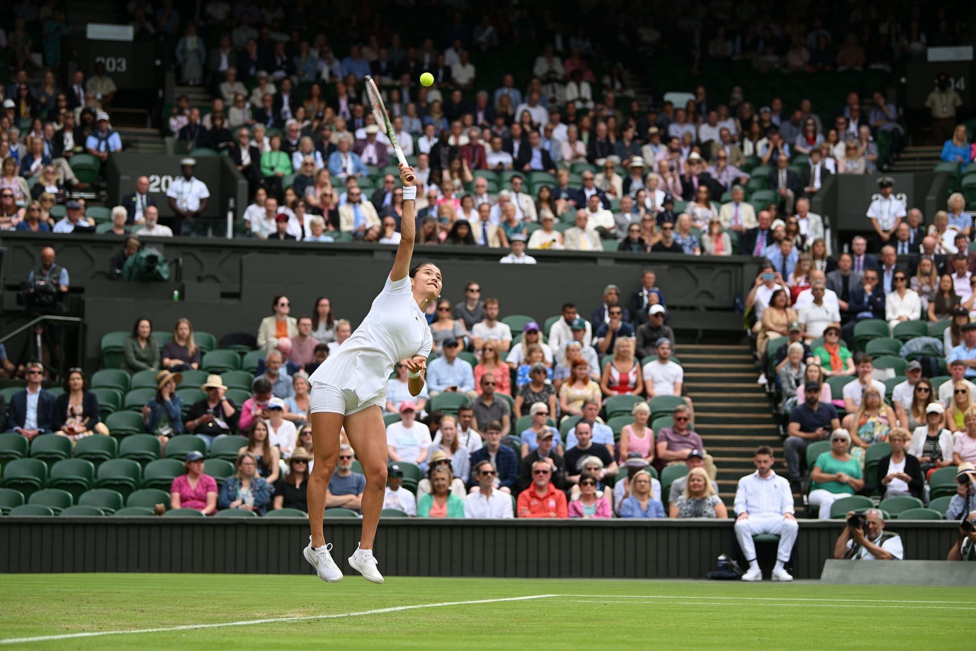 Emma Raducanu in action at The Championships - Wimbledon 2022