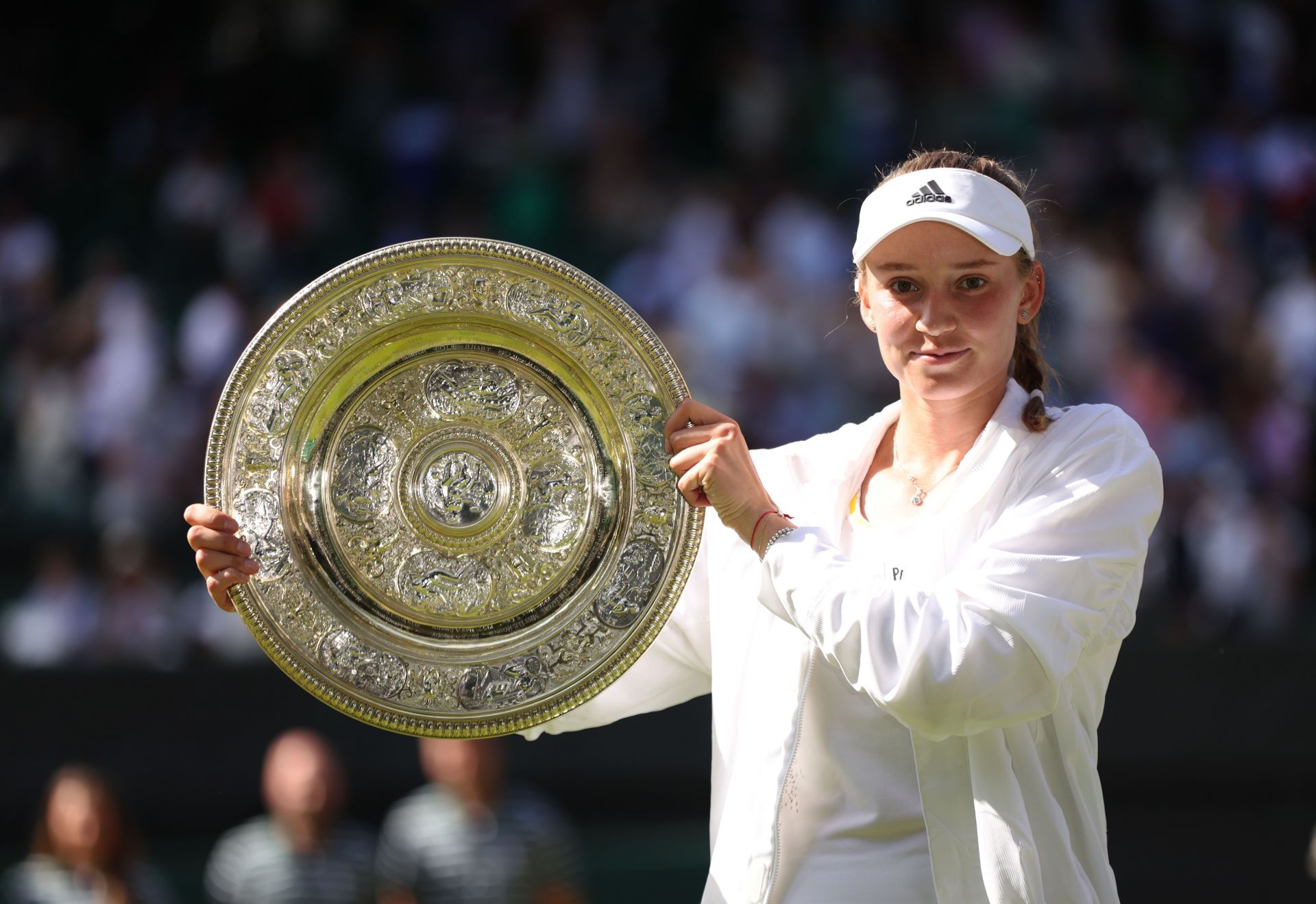 Elena Rybakina hoists aloft the Venus Rosewater Dish on Saturday at Wimbledon.