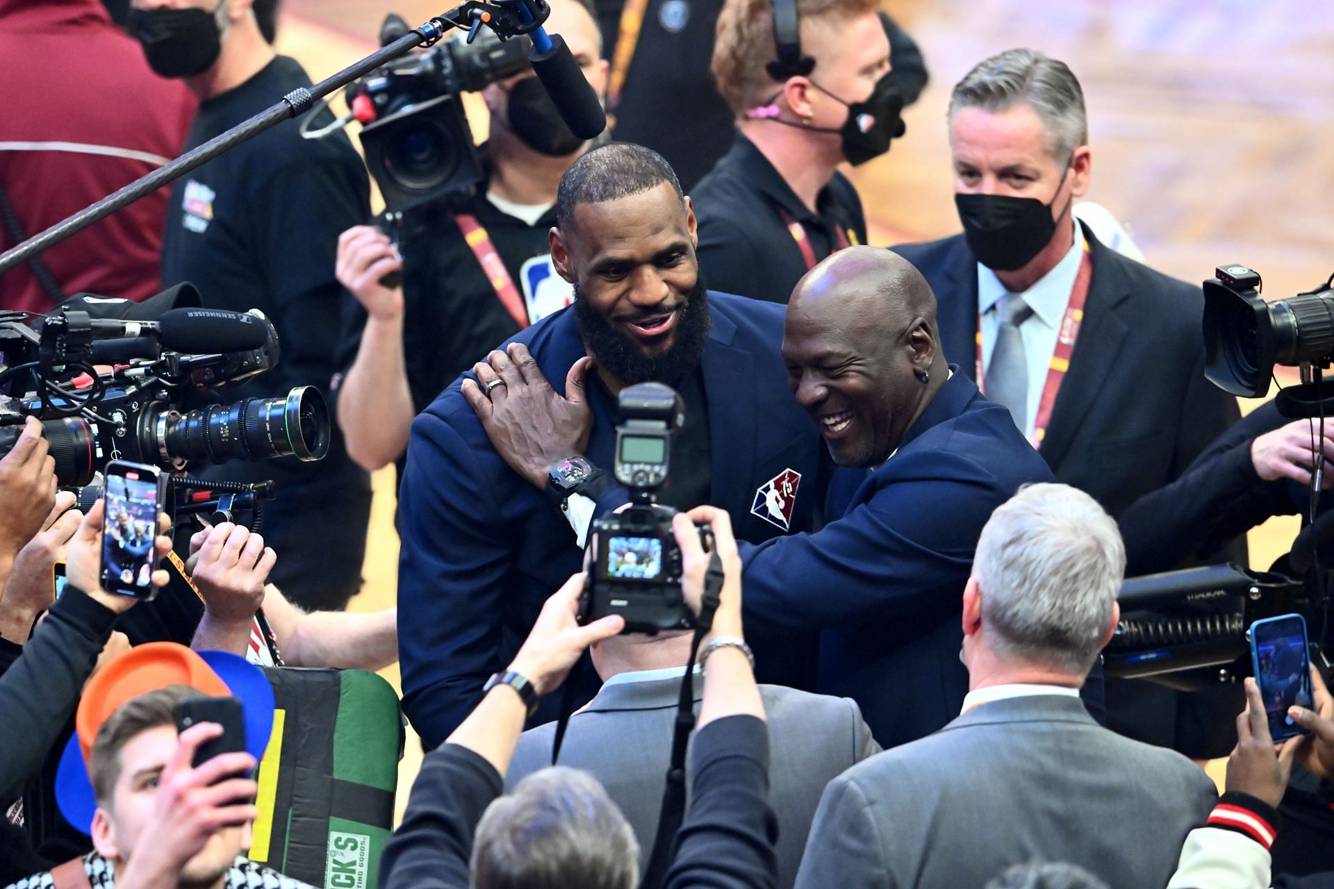 Michael Jordan and LeBron James hug after the presentation of the NBA 75th Anniversary Team