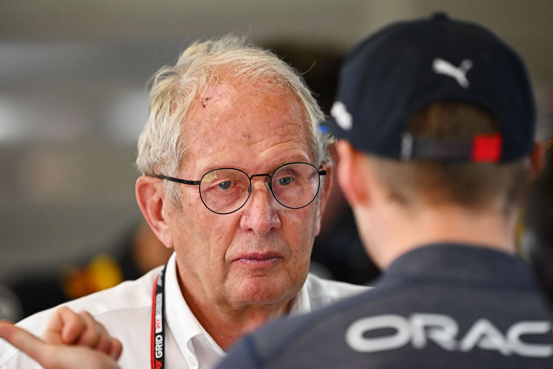 Helmut Marko talks to Max Verstappen (foreground) during the 2022 F1 Grand Prix of Spain - Final Practice