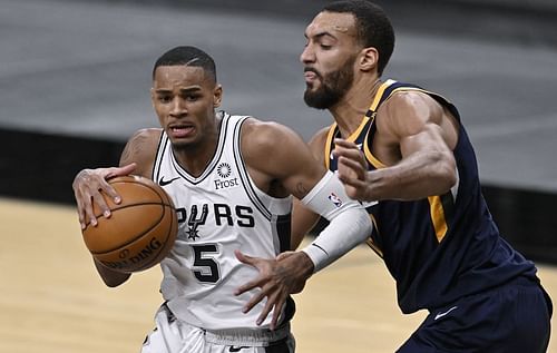 Dejounte Murray of the San Antonio Spurs against Rudy Gobert of the Utah Jazz in 2022 [Source: AP]