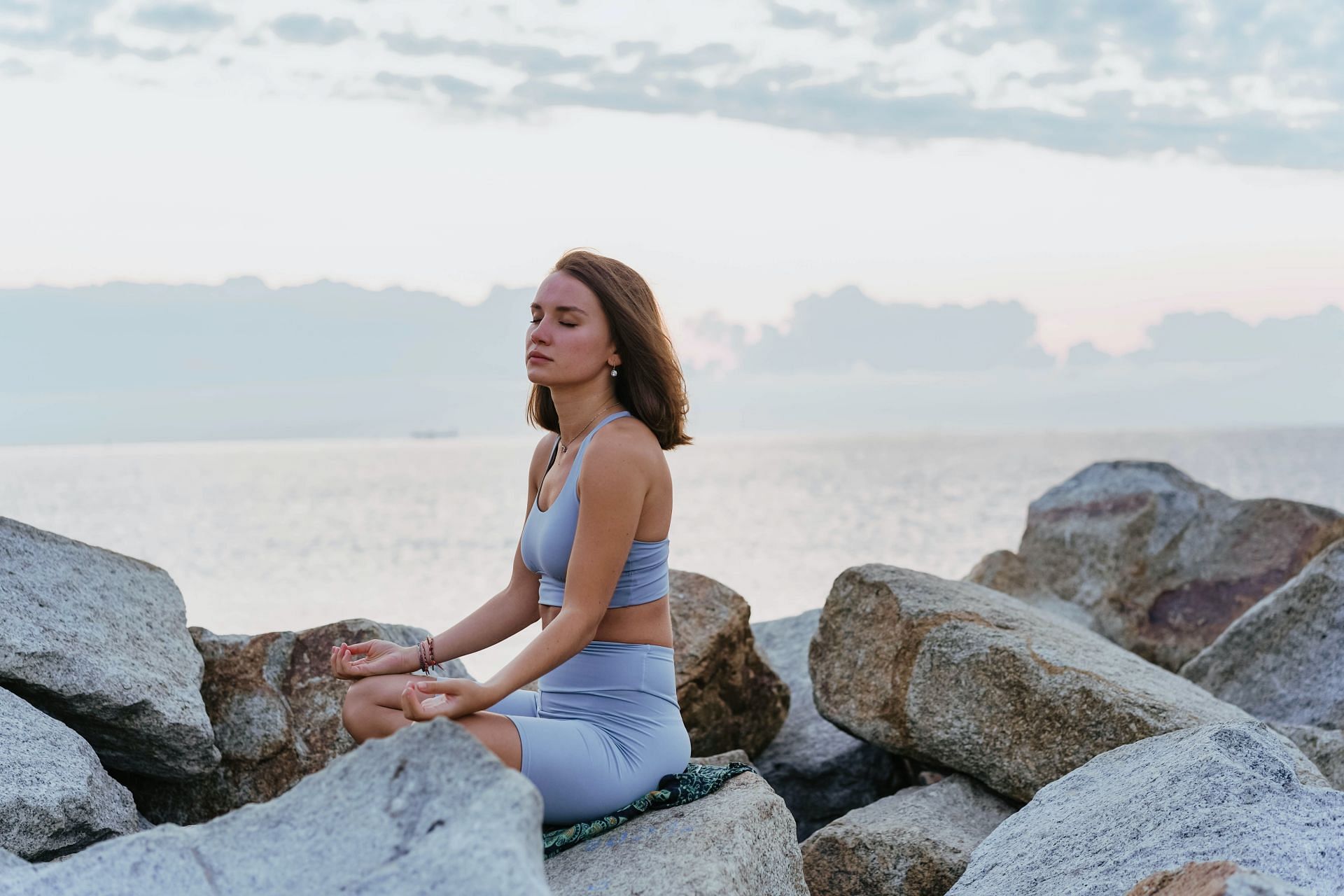 Restorative yoga is a great way to heal and relax your mind. (Image via Pexels / Olia Danilevich)