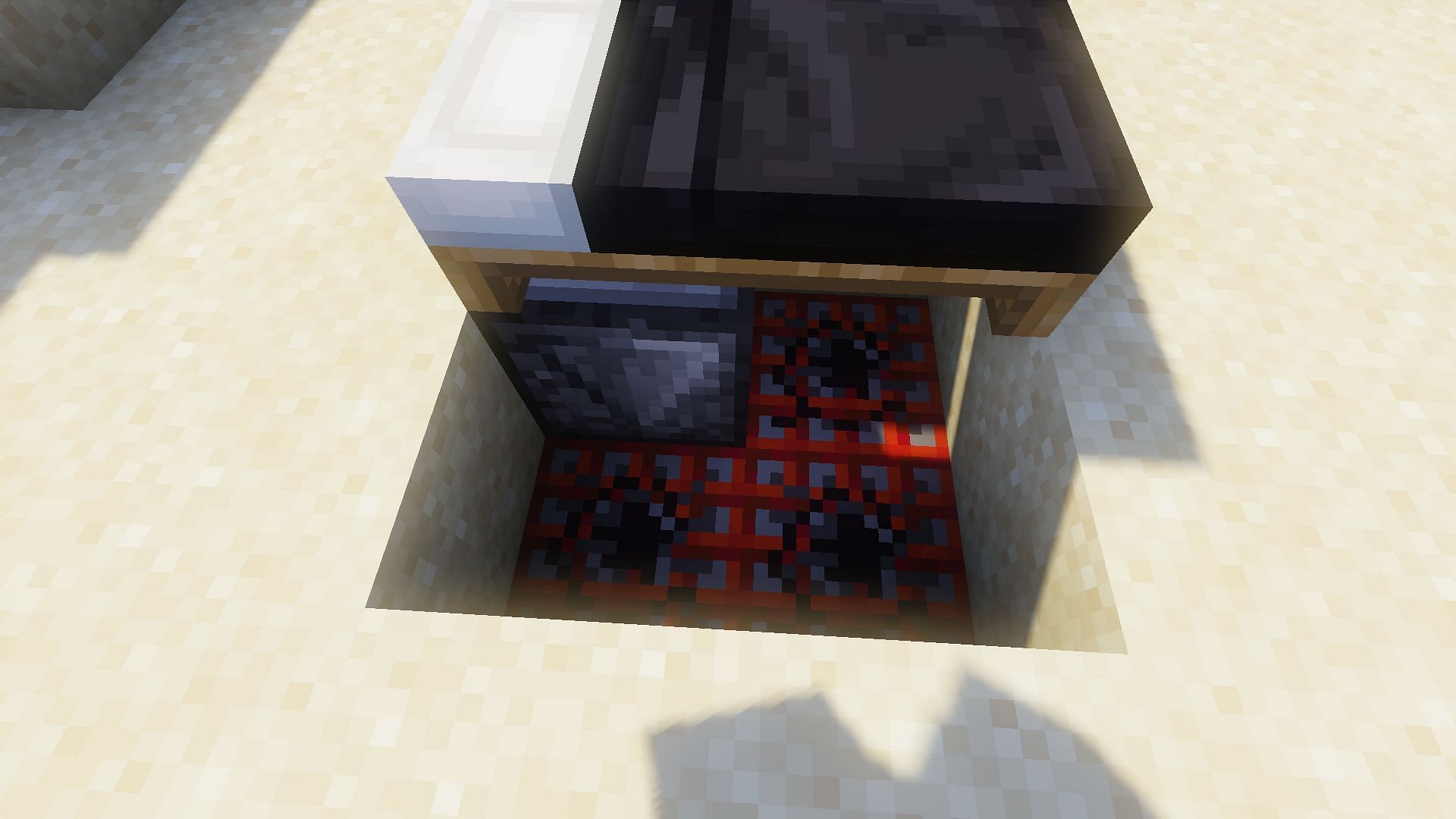 The TNT placed underneath the bed (Image via Minecraft)