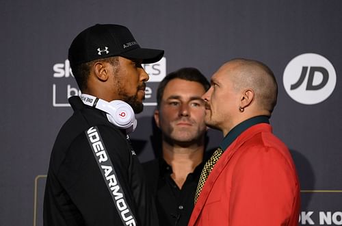 Anthony Joshua and Oleksandr Usyk face off at a press conference with Eddie Hearn