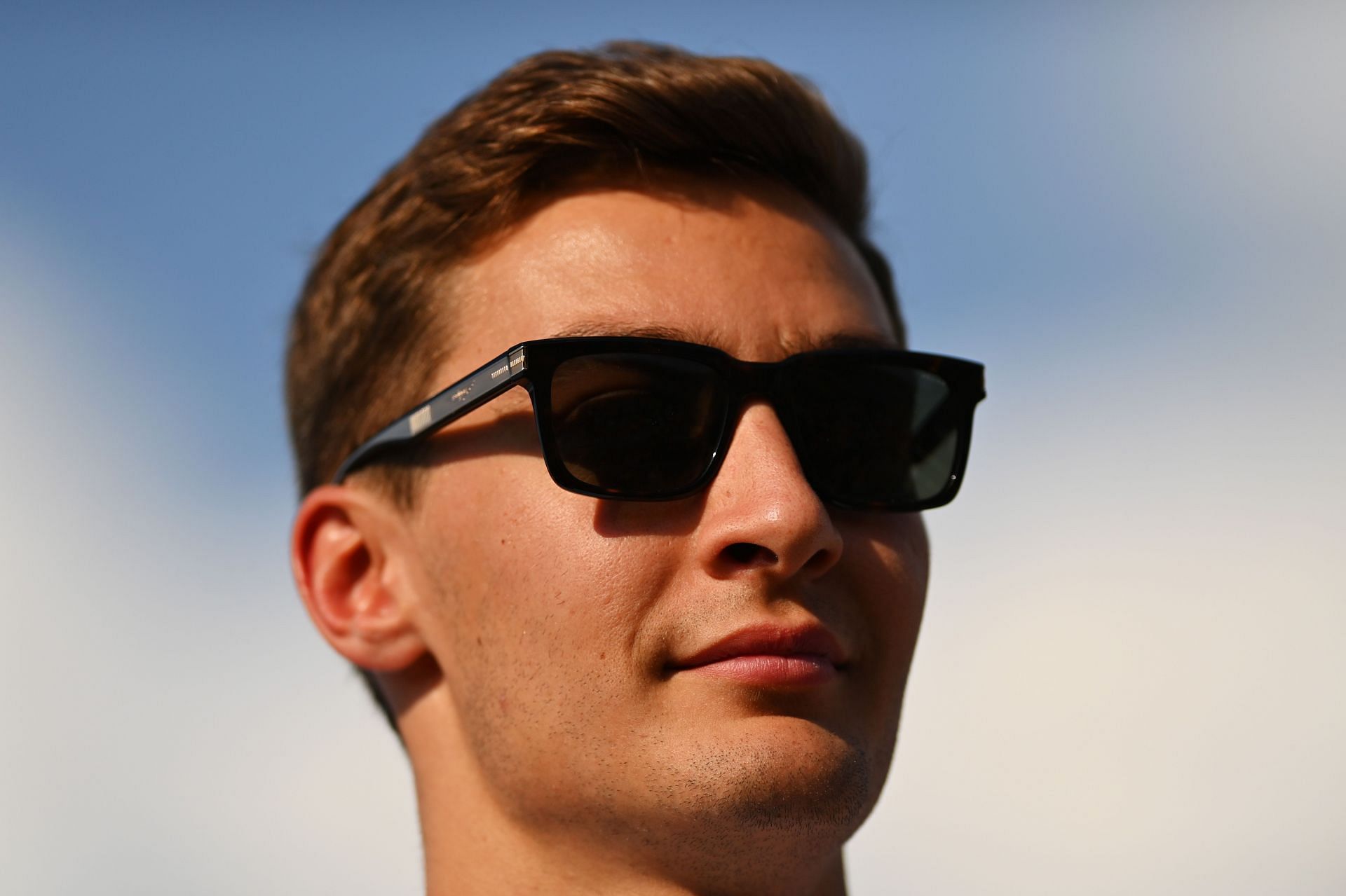George Russell looks on in the Paddock ahead of the F1 Grand Prix of Hungary. (Photo by Dan Mullan/Getty Images)