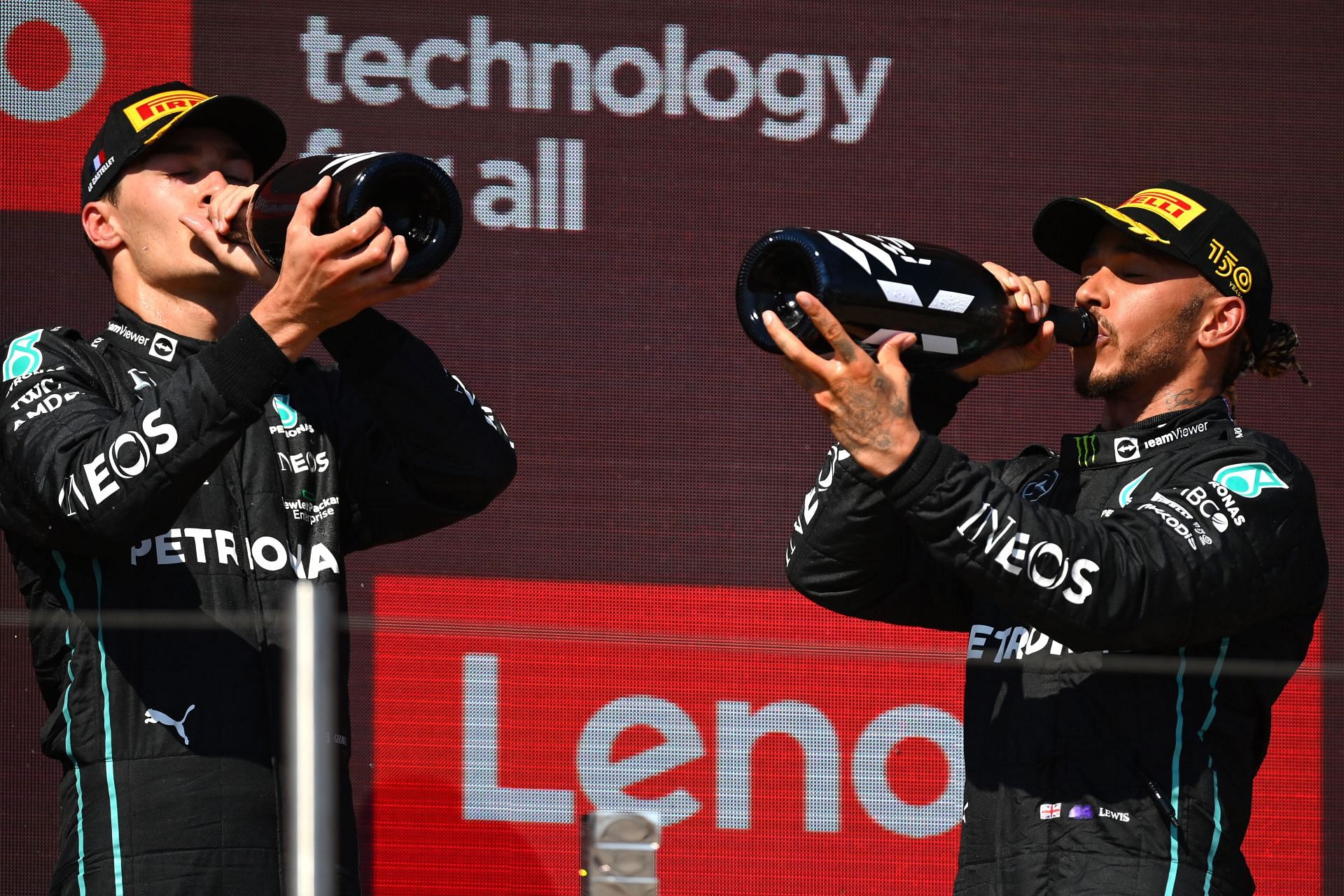 Mercedes drivers George Russell (left) and Lewis Hamilton (right) celebrate after scoring a double podium at the 2022 F1 French GP (Photo by Dan Mullan/Getty Images)