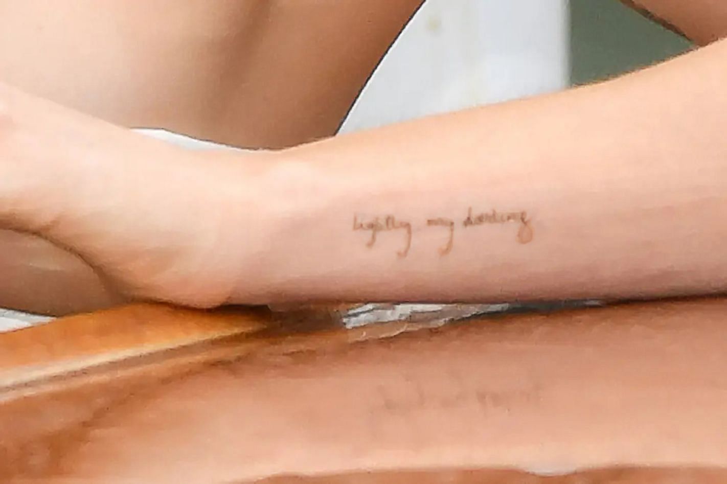 Johnson&#039;s left forearm tattoo says &quot;lightly my darling&quot; (Image via Getty)