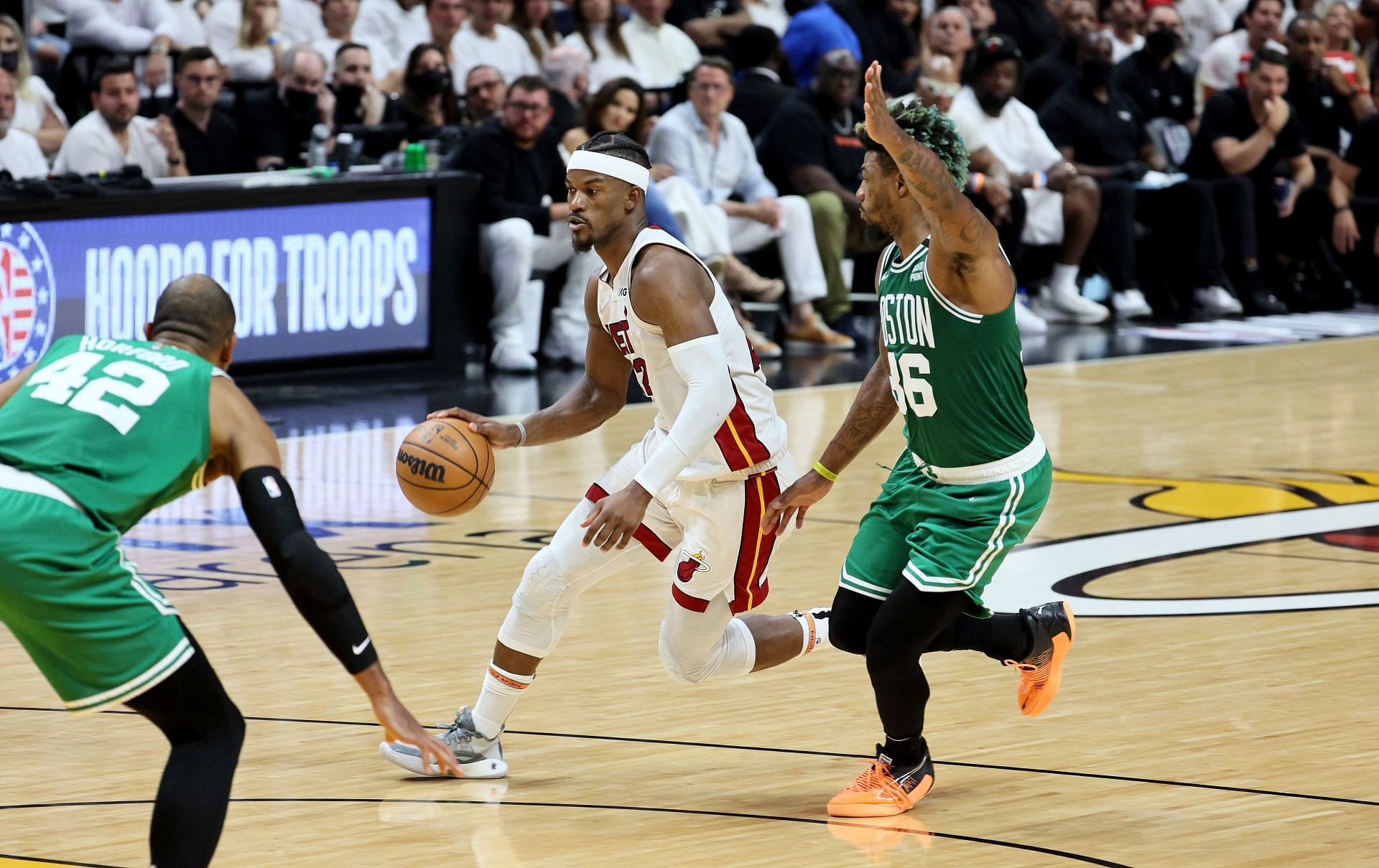 Jimmy Butler dribbles the ball against the Boston Celtics