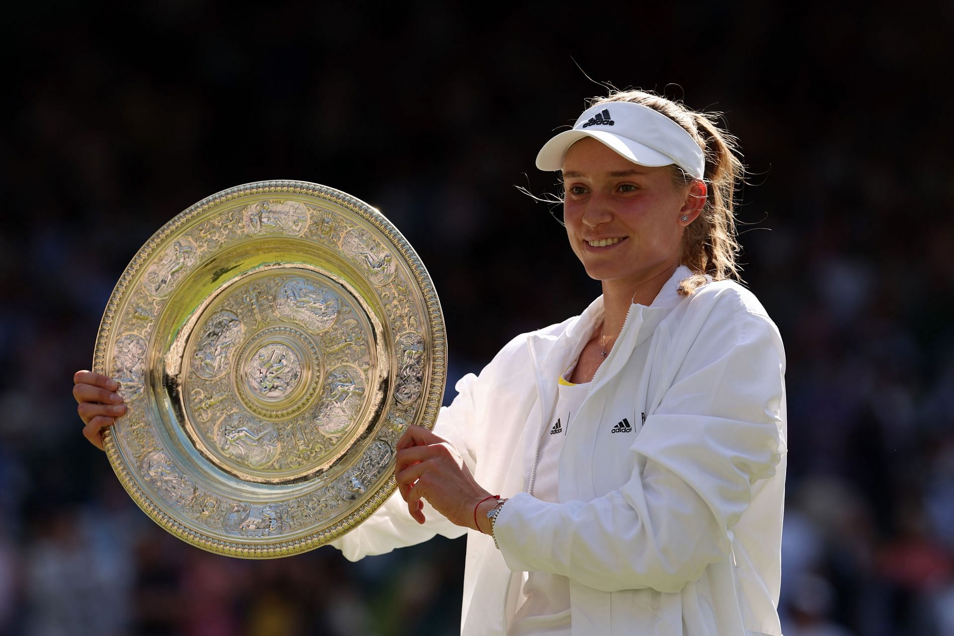 Elena Rybakina poses with the 2022 Wimbledon title.
