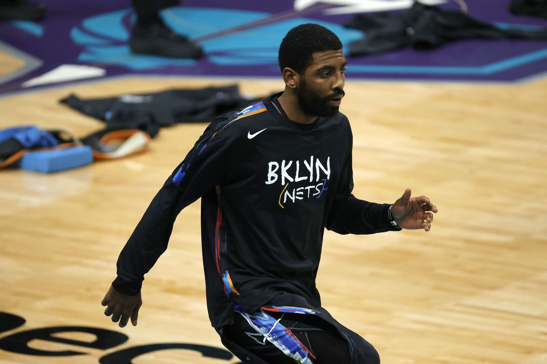 Kyrie Irving warms up before a Brooklyn Nets game