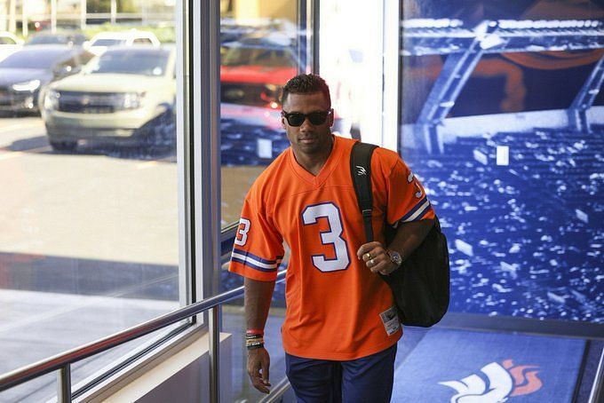 Russell Wilson shows up to Broncos training camp in own jersey, THE HERD