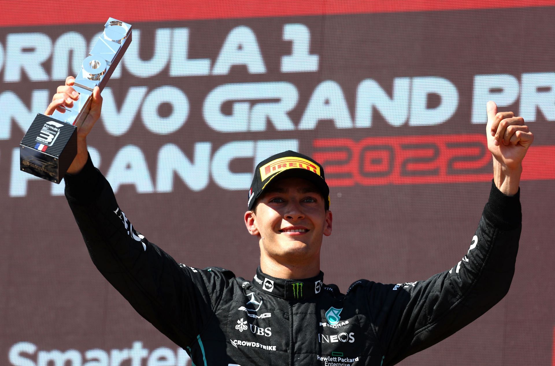 Third-placed George Russell celebrates on the podium during the F1 Grand Prix of France at Circuit Paul Ricard on July 24, 2022, in Le Castellet, France (Photo by Clive Rose/Getty Images)