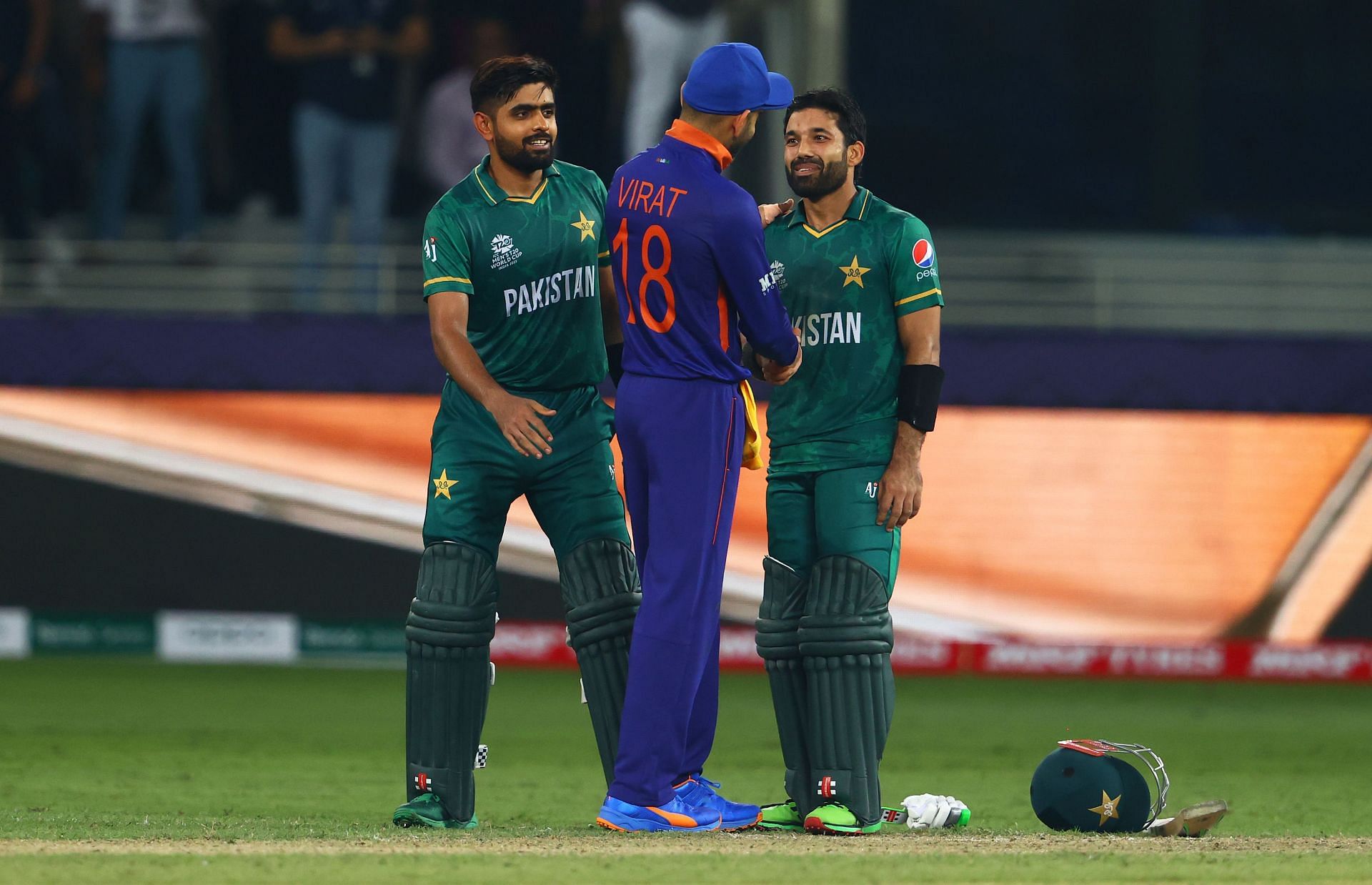 Kohli (C) greeting Babar (L) and Rizwan (R) after their encounter at the 2021 T20 World Cup
