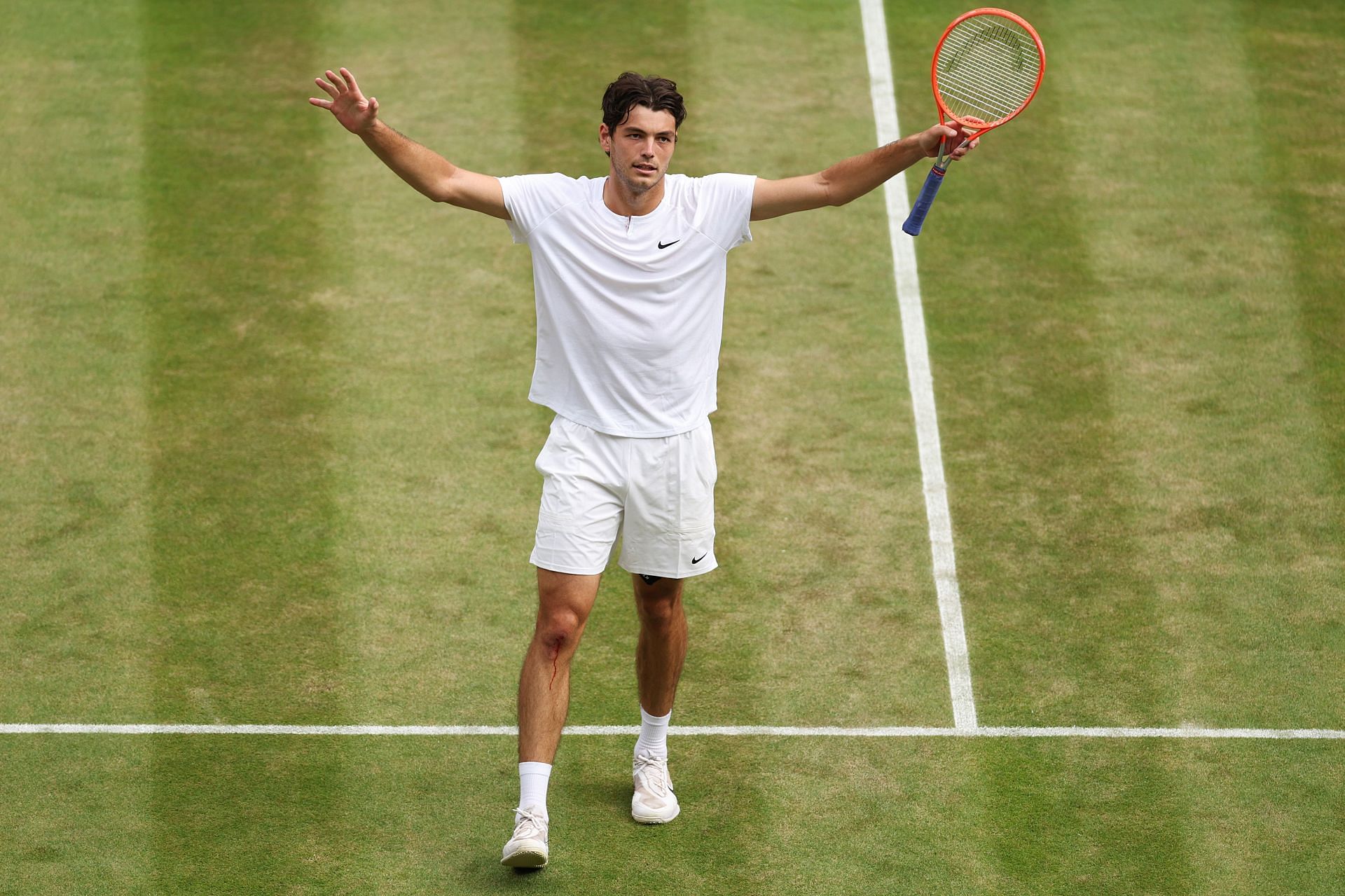 Taylor Fritz exults after reaching the Wimbledon last eight.