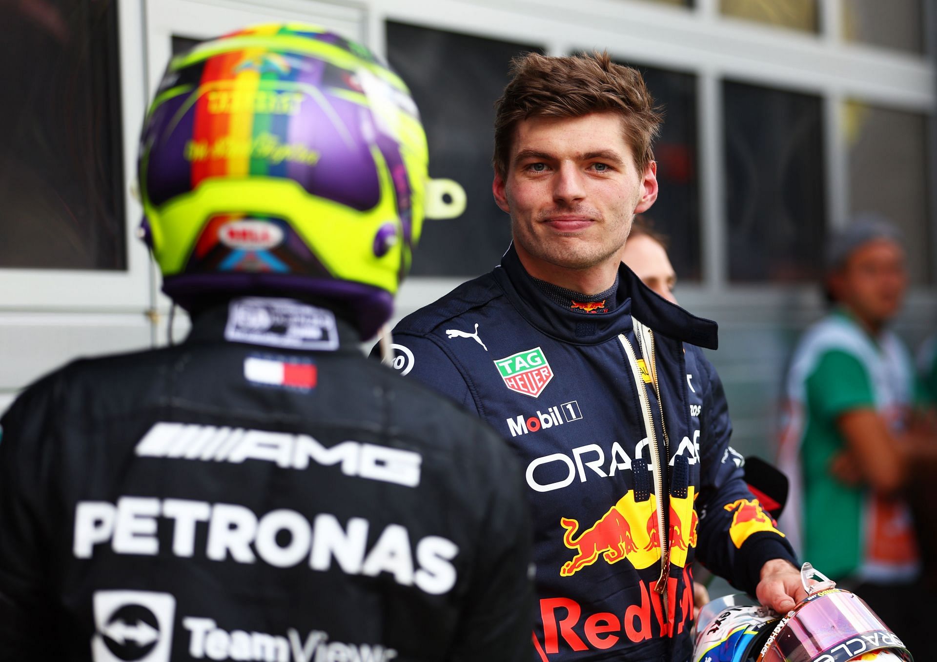 Max Verstappen (background) and Lewis Hamilton (foreground) talk in parc ferm&eacute; during the F1 Grand Prix of Austria at Red Bull Ring on July 10, 2022, in Spielberg, Austria (Photo by Bryn Lennon/Getty Images)