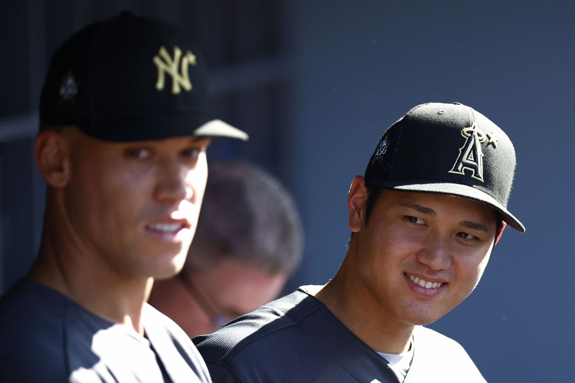 Aaron Judge #99 of the New York Yankees and Shohei Ohtani #17 of the Los Angeles Angels look on from the dugout before the 92nd MLB All-Star Game
