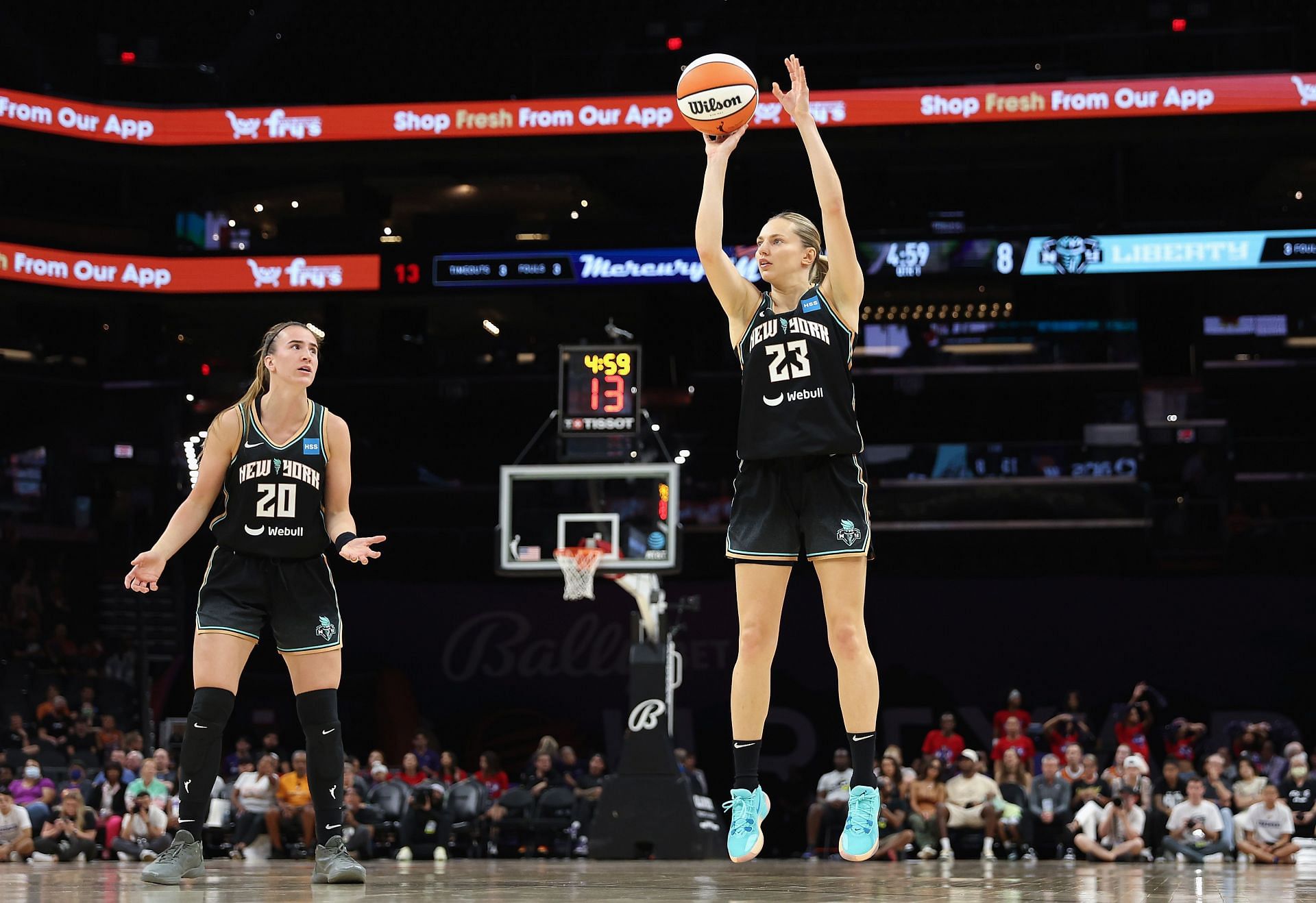 Sabrina Ionescu attempts a three-pointer