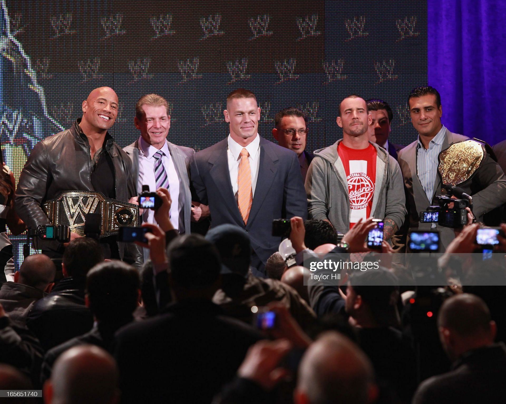 The Rock, alongside fellow WWE Superstars