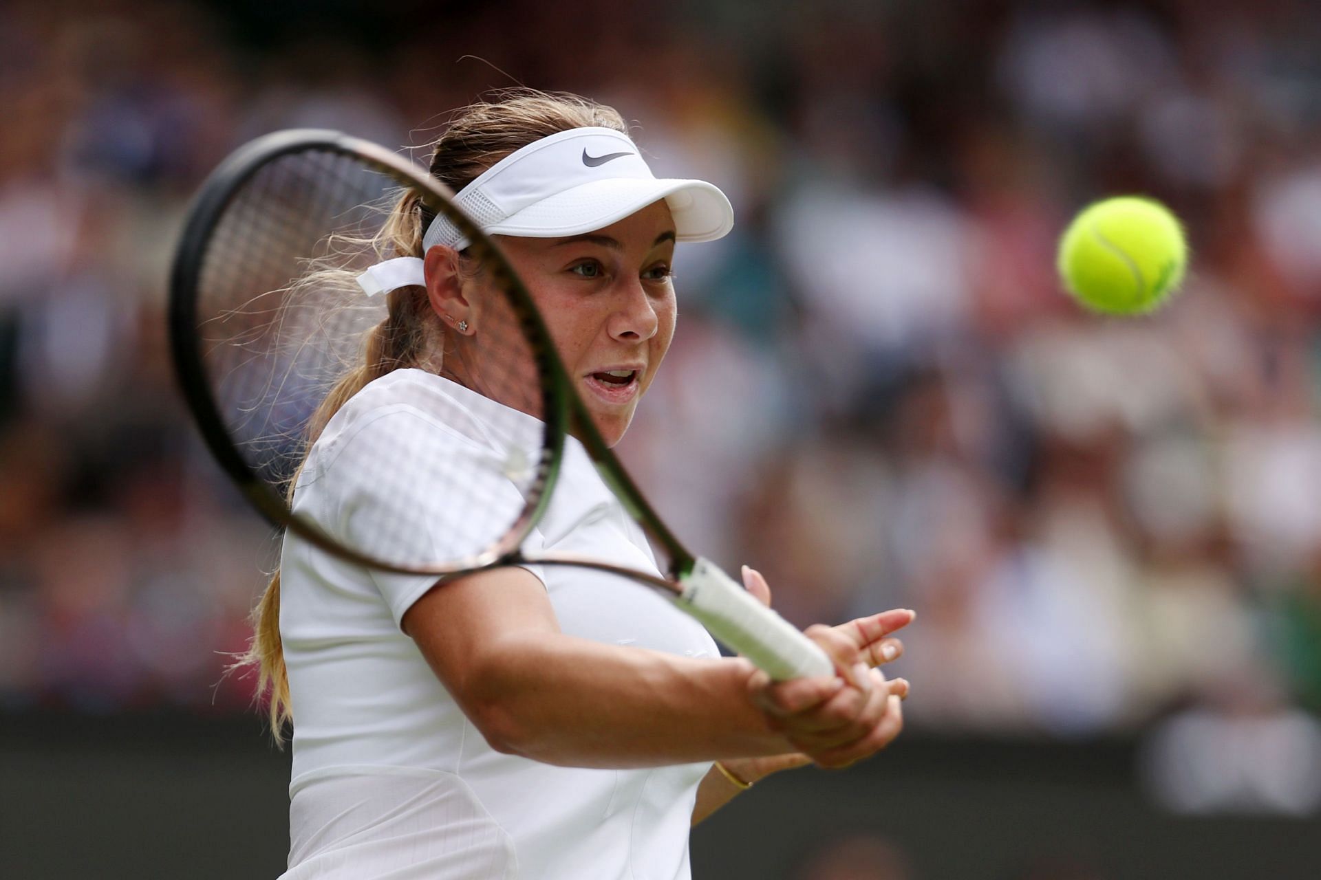 Anisimova strikes the ball during her third-round match at the 2022 Championships