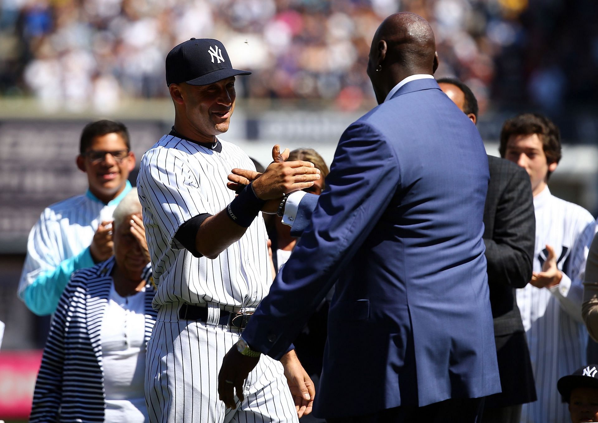 Derek Jeter and Michael Jordan during an MLB game in 2014