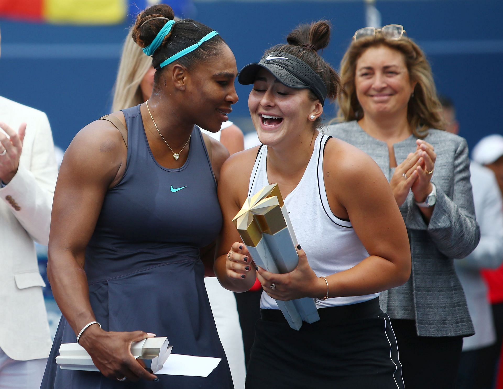 Canadian Open 2019 champion Bianca Andreescu and runner-up Serena Williams share a light moment during the trophy ceremony