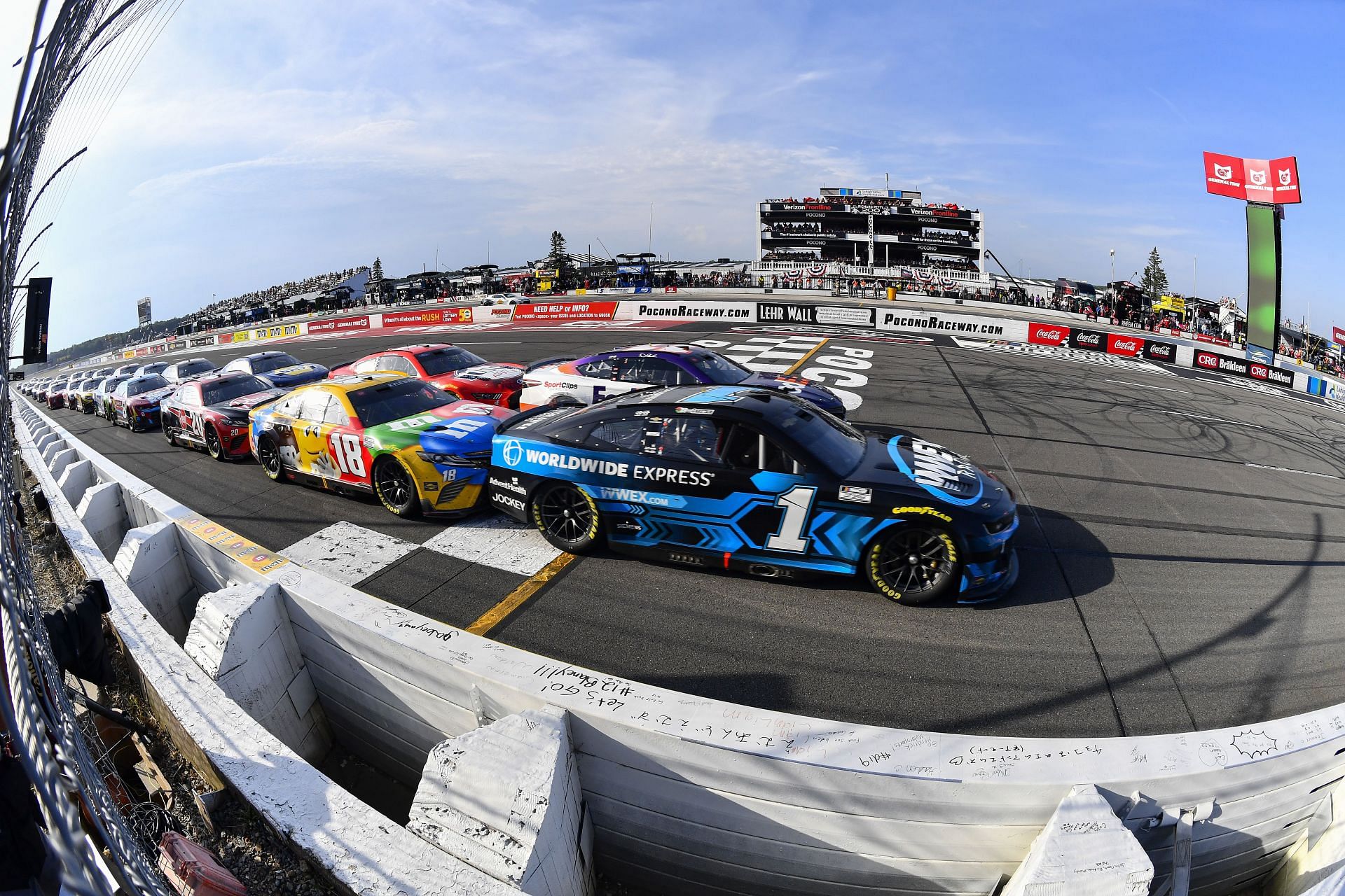 Ross Chastain (#1 Worldwide Express Chevrolet) leads the field during the 2022 NASCAR Cup Series M&amp;M&#039;s Fan Appreciation 400 at Pocono Raceway in Long Pond, Pennsylvania. (Photo by Logan Riely/Getty Images)