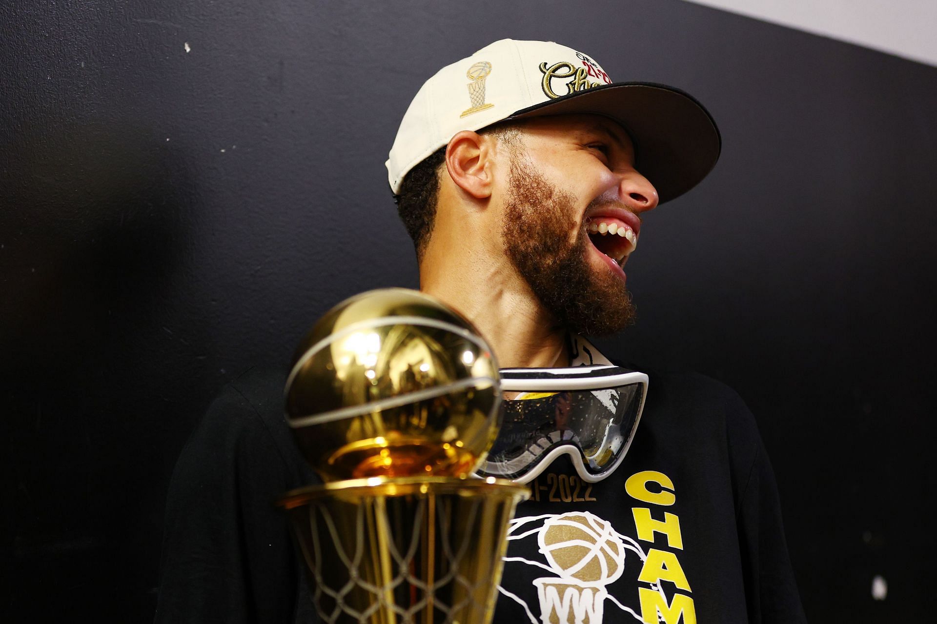Stephen Curry of the Golden State Warriors celebrates with Most Valuable Player Award