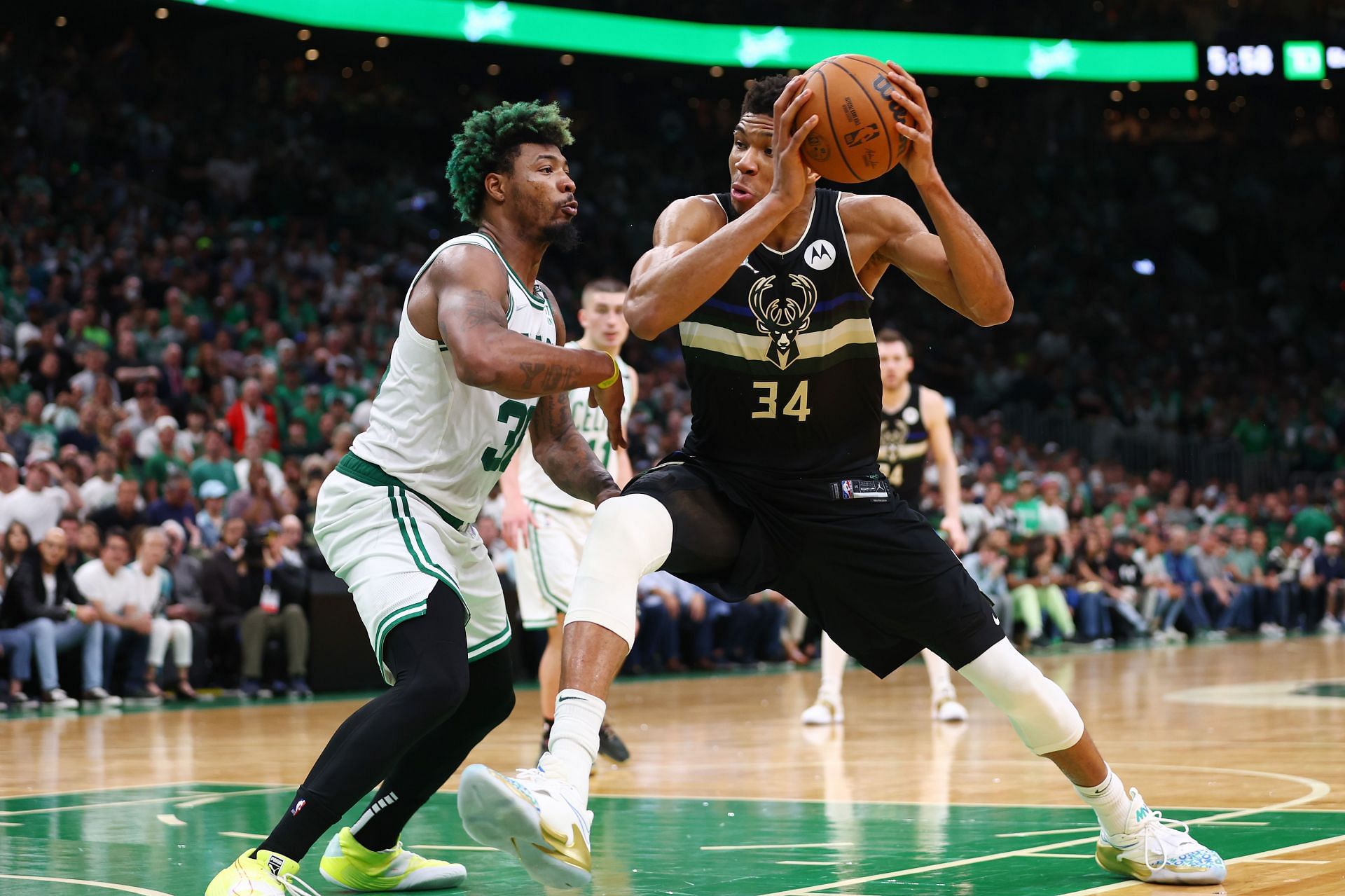 Giannis Antetokounmpo #34 of the Milwaukee Bucks drives to the basket against Marcus Smart #36 of the Boston Celtics