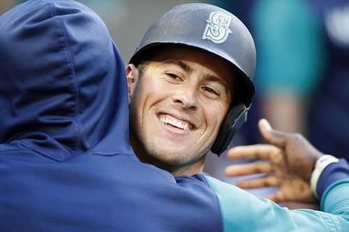 Seattle Mariners infeilder Dylan Moore celebrates an unusual home run against the Toronto Blue Jays.