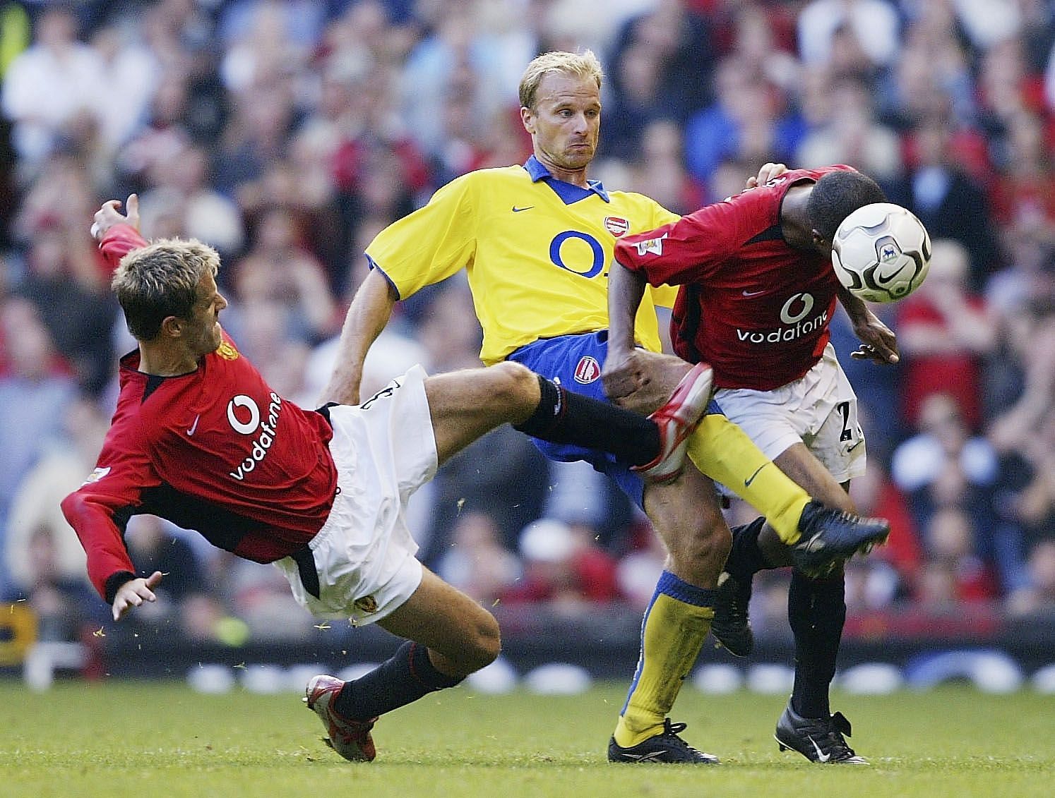 Quinton Fortune, Phil Neville and Dennis Bergkamp