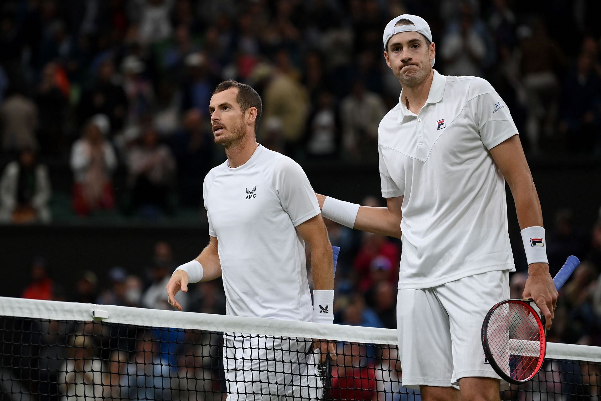 Andy Murray and John Isner at the 2022 Wimbledon.