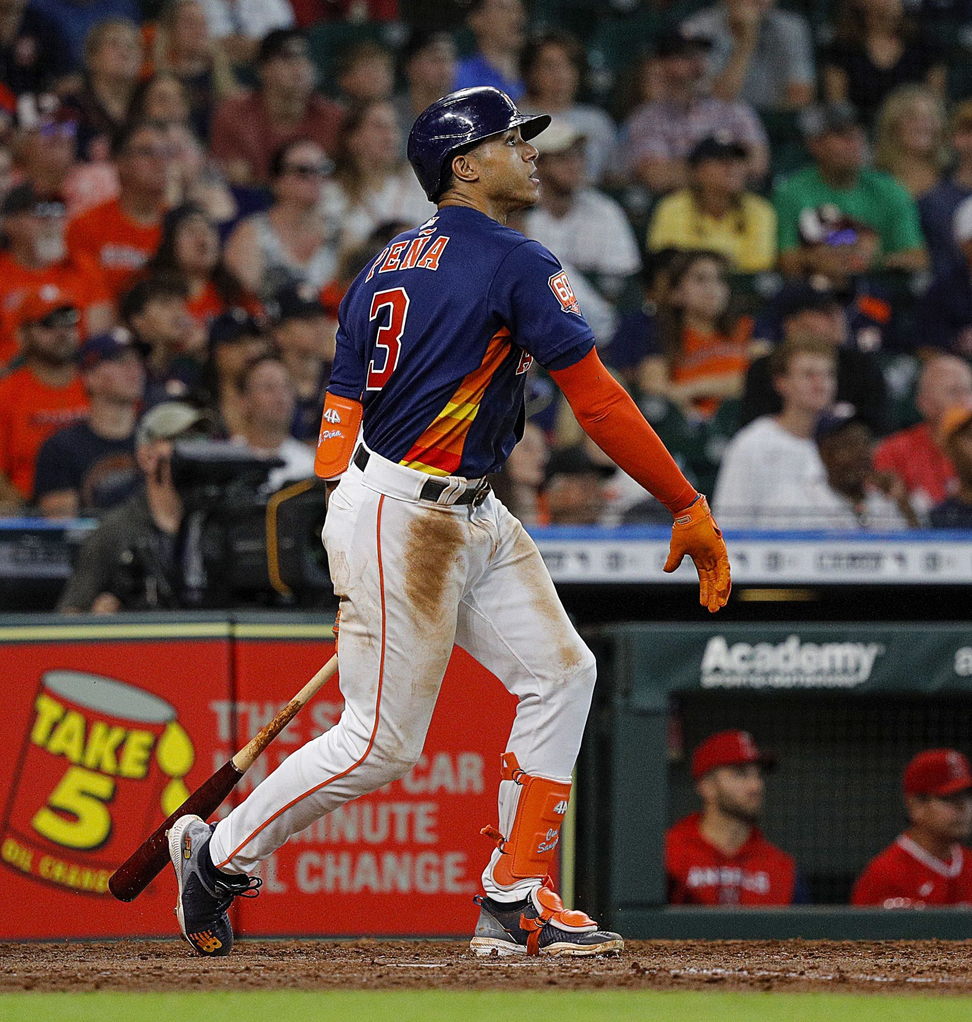 Houston Astros' Jeremy Pena watches his hits an RBI single during